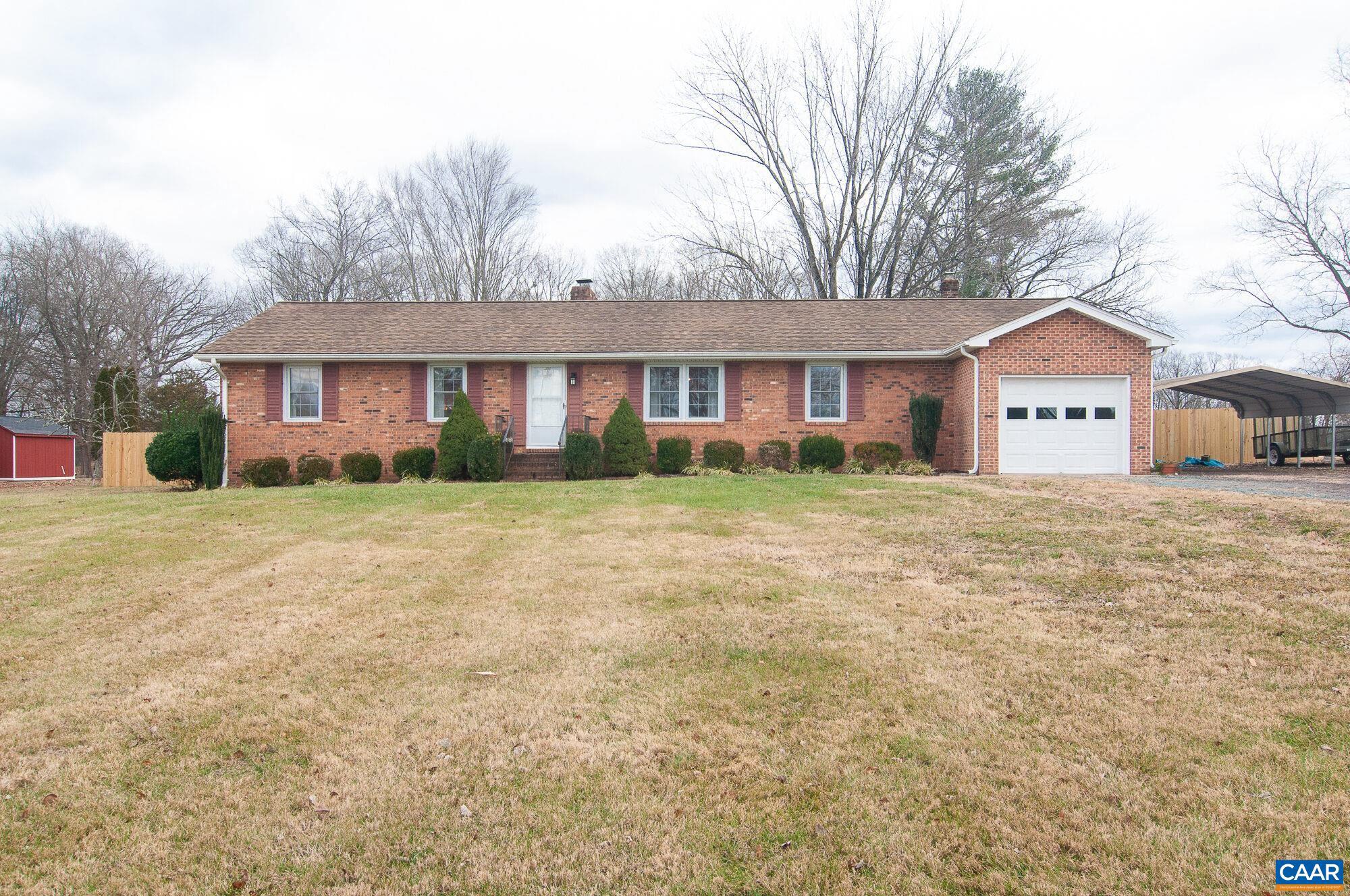 NEW PRICE!  This charming 1975-built brick rancher offers a perfect blend of timeless elegance and modern convenience. The exterior showcases classic brickwork and architectural roofing, giving it a distinctive and inviting curb appeal. Inside, the living room welcomes you with a cozy gas log fireplace. The open floor plan flows into the dining area and spacious kitchen, which features modern appliances and ample cabinetry. The three generously sized bedrooms provide comfort and privacy for all. Two updated bathrooms add to the appeal, featuring contemporary fixtures and finishes that exude style and luxury. For added convenience, an attached garage allows for direct access to the home, making it easy to unload groceries and stay dry in inclement weather. This rancher is equipped with new HVAC and water conditioning systems, ensuring a comfortable and energy-efficient living environment. The outdoor living space boasts a Trex deck that extends your living space into the serene backyard. The tall privacy fence offers seclusion and security, creating the perfect setting for entertaining, gardening, or simply enjoying the tranquility of your own private oasis.,Cherry Cabinets,Formica Counter,Fireplace in Family Room