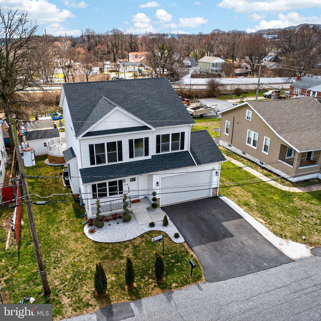 This home offers the rare opportunity to be only the second owner. Built in 2023, this impressive two-story residence features 4 bedrooms, 3.5 bathrooms, and a convenient attached garage. Thoughtfully designed for both comfort and entertaining, the home showcases spacious open-concept living areas filled with natural light. Step inside from the inviting front porch into a bright and airy interior featuring neutral tones, high ceilings, recessed lighting, and beautiful hardwood flooring throughout the main level. Abundant windows enhance the warmth and openness of the space. The main level offers multiple living areas, a powder room, dining spaces that flow seamlessly together. Glass sliding doors lead to the backyard, creating the perfect indoor-outdoor lifestyle. The gourmet kitchen is a true highlight, featuring stainless steel appliances, white cabinetry, quartz countertops, a range hood, a stylish island, and a pantry for additional storage. Upstairs, you’ll find four spacious bedrooms, each with ceiling fans and generously sized closets. The luxurious primary suite boasts double-door entry, a tray ceiling, a walk-in closet, and a spa-like five-piece en-suite bath. The fully finished walk-out basement, complete with a separate entrance and full bathroom, offers exceptional versatility, ideal for a recreation room, guest suite, home office, or studio. Step outside to enjoy the modern oversized deck, perfect for relaxing or entertaining, along with a storage shed for added convenience. Schedule your private tour today and take advantage of the rare opportunity to own this exceptional home as only its second owner. HOME WARRANTY AVAILABLE