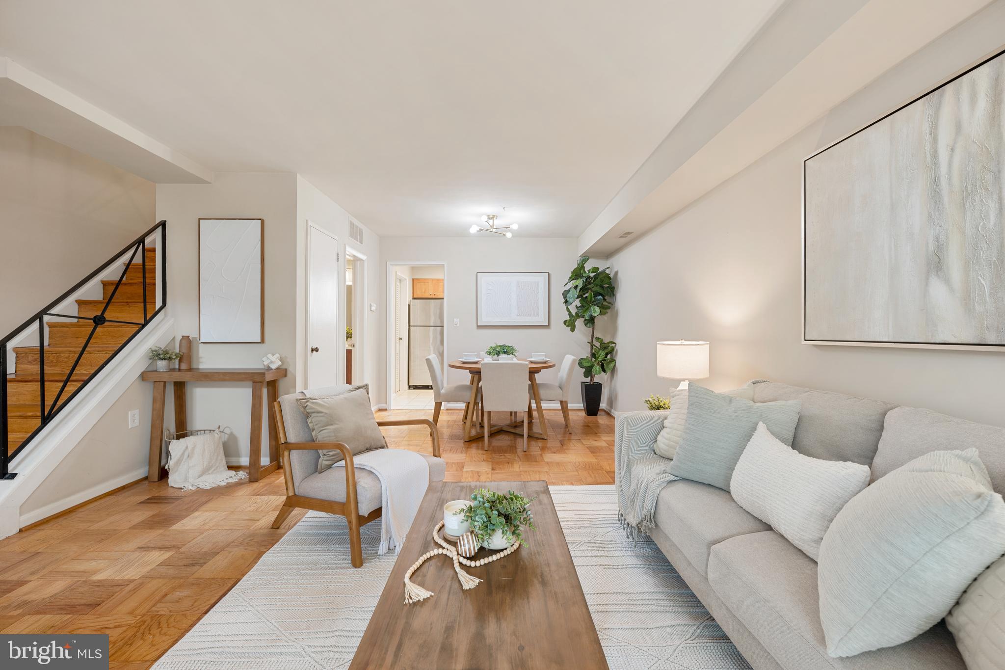 *VA ASSUMABLE LOAN* Welcome home to Fairlington Towne! This quaint and charming community is tucked away in a private, peaceful setting yet perfectly positioned for everything Alexandria has to offer. Classic wood parquet flooring sets the tone on the main level, where a large picture window floods the living room with abundant natural light and the open layout flows seamlessly into the dining area - ideal for everyday living and entertaining alike. Continue into the updated kitchen, featuring rich wooden cabinetry, modern stainless steel appliances, and sleek granite countertops. Upstairs, gleaming hardwood floors and vaulted ceilings carry through both bedrooms, each offering ample closet space. The primary bedroom is generously sized with enough room for a private sitting area, while the second bedroom is ideal as a guest room, home office, or whatever suits your needs. Both bedrooms share a stylishly updated full bathroom in the hallway. From the main level, step outside to enjoy a private back patio, perfect for relaxing or unwinding in your own outdoor retreat. Residents of this popular community enjoy access to beautiful common grounds and open parking right near your front door. Conveniently located just minutes to Safeway, Fresh Market, Target, Bradlee Shopping Center, Old Town Alexandria, Village at Shirlington, Fairlington parks, and the Four Mile Run and W&OD Trail. Quick access to King Street, I-395, I-495, Van Dorn Street, Columbia Pike, and Duke Street, with a bus stop less than half a mile away at the corner of Dearing and King. Schedule a private tour of your beautiful new home today!