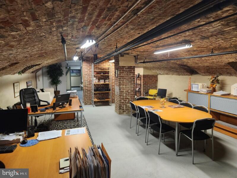 Envision running your business in a modern, organic, aesthetically delightful space in one of Philadelphia's busiest locations: Old City!  Enter through sliding barn door & wander under the vaulted brick ceiling through a wide space with an open floor plan and powder room.  Eye-catching arches throughout, exposed brick, fresh paint, and finished walls and flooring make this unique, raw commercial space in Old City's historic Malt House so appealing!  Also includes a kitchenette with stainless steel refrigerator, basin and counters, cabinets and bright lighting. Condo fees are just $255/month and  the taxes are reasonable too. The possibilities are endless: an artist's studio, salon, architect's workspace, wine cellar, office with conference room and ample desk areas, etc.  Perfect for inexpensive storage for any business in Old City. With a Walk Score  of 95 and diverse businesses all around, you will enjoy the best of Philly at your fingertips and customers at your door. Check out our YouTube tour,  simply search "Malt house Condo". Property is available for a lease for $995/month. 2 year lease minimum.