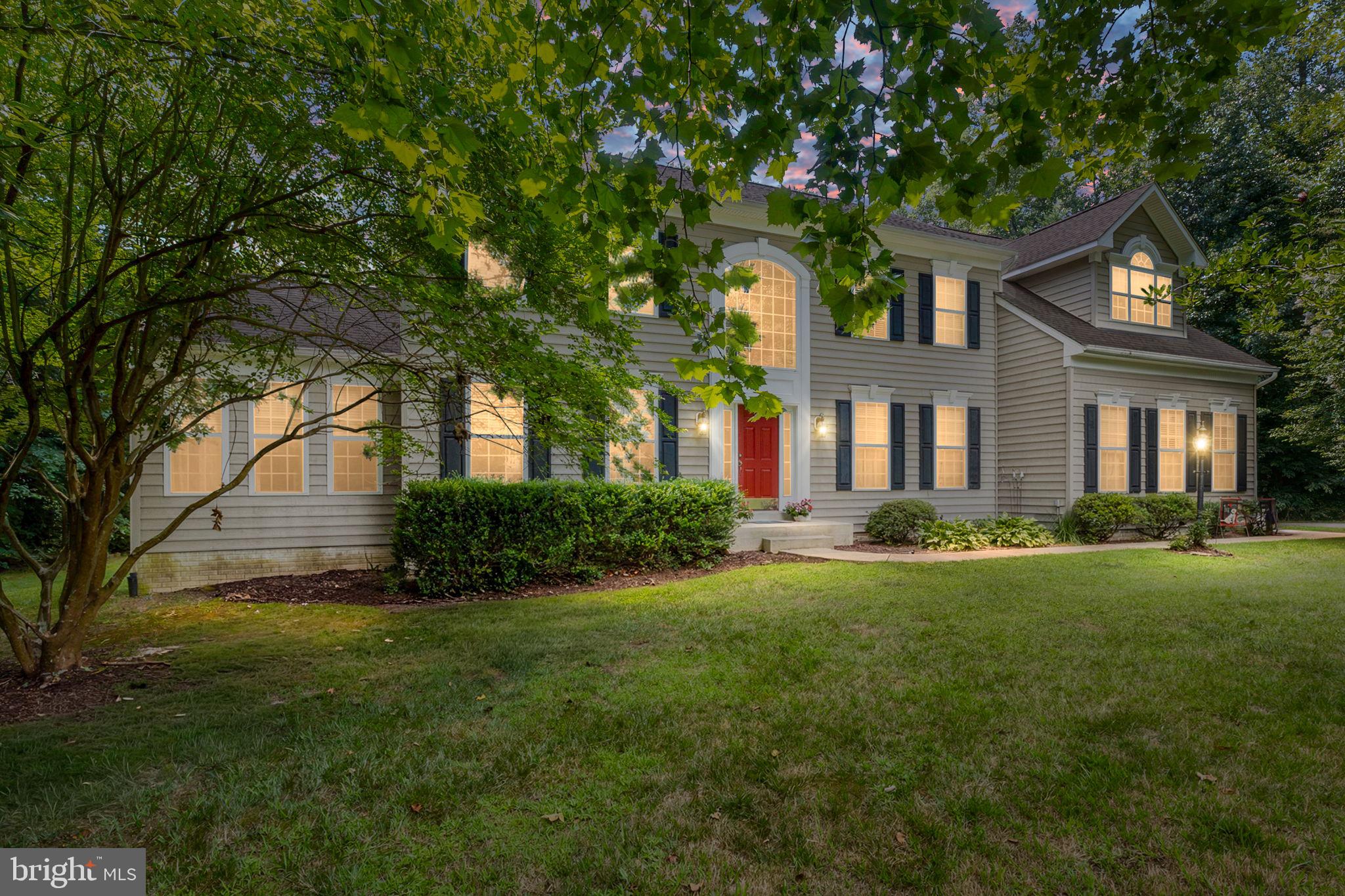 Nestled within the prestigious Worman Estates, this exquisite Colonial residence spans over 6,000 sq. ft. of luxurious living space and is set on a sprawling 10.23-acre lot that seamlessly blends elegance with nature. The grand entrance features a double staircase that leads to an open floor plan adorned with crown moldings and chair railings, creating an inviting ambiance. A wonderful kitchen, equipped with high-end appliances including a self-cleaning double wall oven and new cooktop, is perfect for culinary enthusiasts. The kitchen is perfectly placed beside the seperate dining room, just off the family room, a separate sun room, and right next to a massive potential pantry/laundry room and the siding loading garage for quick grocery runs! The home boasts a cozy double-sided fireplace, enhancing the warmth of the living areas. The main level also offers a large bedroom and full bathroom, a formal living space and den. There is a private screened deck just off the den and a huge deck off the sunroom that leads to a lovely backyard overlooking a serene backdrop of trees and includes an in-ground pool, inviting relaxation and leisure. Upstairs, retreat to the spacious primary suite, complete with a sitting area and a large en-suite bath. There are 3 large bedrooms upstairs as well as a full hall bath. Additional highlights include a full basement with walkup access and an attached side-entry garage. There is a water treatment system in place, lots of new updates, and it is move-in ready. Experience an exclusive lifestyle in this gated community, where space is limitless.