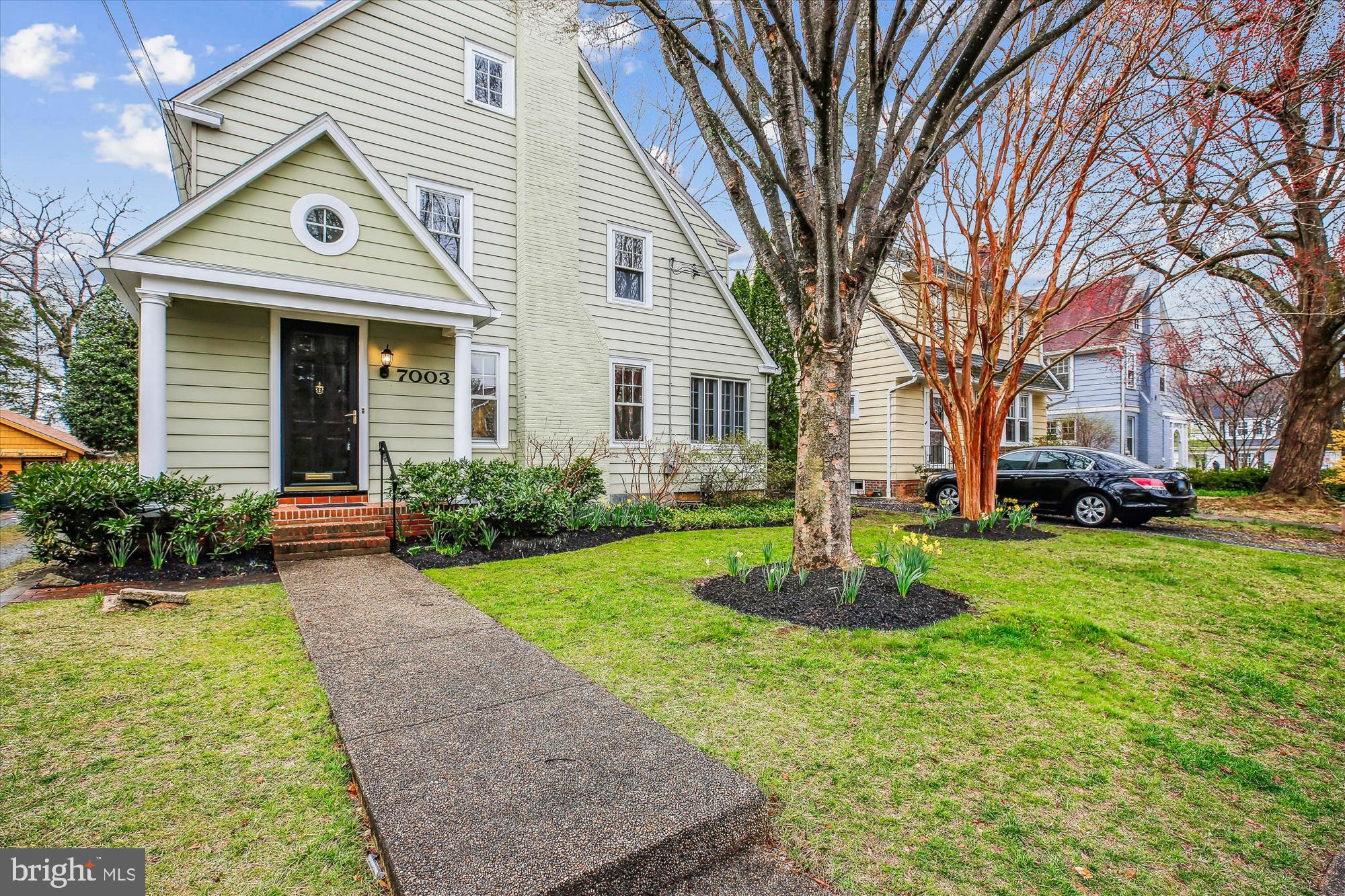 Nestled in the heart of Chevy Chase Village, this enchanting 1926 Tudor-style home seamlessly blends historic charm with modern convenience. Thoughtfully expanded with a large two-story addition, the home retains its original architectural details, including hardwood floors, intricate wood trim, glass doorknobs, mill-work, and custom wood valances. The inviting main level features a welcoming foyer, a spacious living room with a wood-burning fireplace, a sun-filled formal dining room with chair rail molding, a versatile sunroom or office with three exposures, a functional kitchen with a pantry and breakfast counter, and a stunning family room addition with vaulted ceilings, built-ins, recessed lighting, and access to a charming brick patio. The main level is complete with a powder room and a coat closet. 

Upstairs, four generous bedrooms feature ceiling fans and two updated bathrooms, including a primary suite with soaring ceilings, a walk-in closet with an organizing system, and a renovated dual-entry bath with a glass-enclosed shower with a bench and skylight. A large walk-up attic offers voluminous storage and the potential to be finished, creating an additional level of living space. The unfinished lower level includes a workshop, laundry area, and abundant storage space, offering plenty of room for organization and future possibilities.

The beautifully landscaped level backyard has two brick patios, garden beds with Black-Eyed Susans, a shared driveway, and a detached oversized garage. Ideally located in close-in Chevy Chase, this home is valued for its convenient location, elegant homes on quiet tree-lined streets, and proximity to the shops and restaurants along upper Wisconsin and Connecticut Avenues. Just steps from Brookville Market, Gazebo Park, and Historic La Ferme Restaurant, and minutes from the dining and entertainment centers of downtown Bethesda and Northwest DC, this home offers a perfect blend of charm, space, and accessibility. It is also conveniently located near the Capital Beltway and downtown Washington, D.C., within the Bethesda-Chevy Chase school cluster.