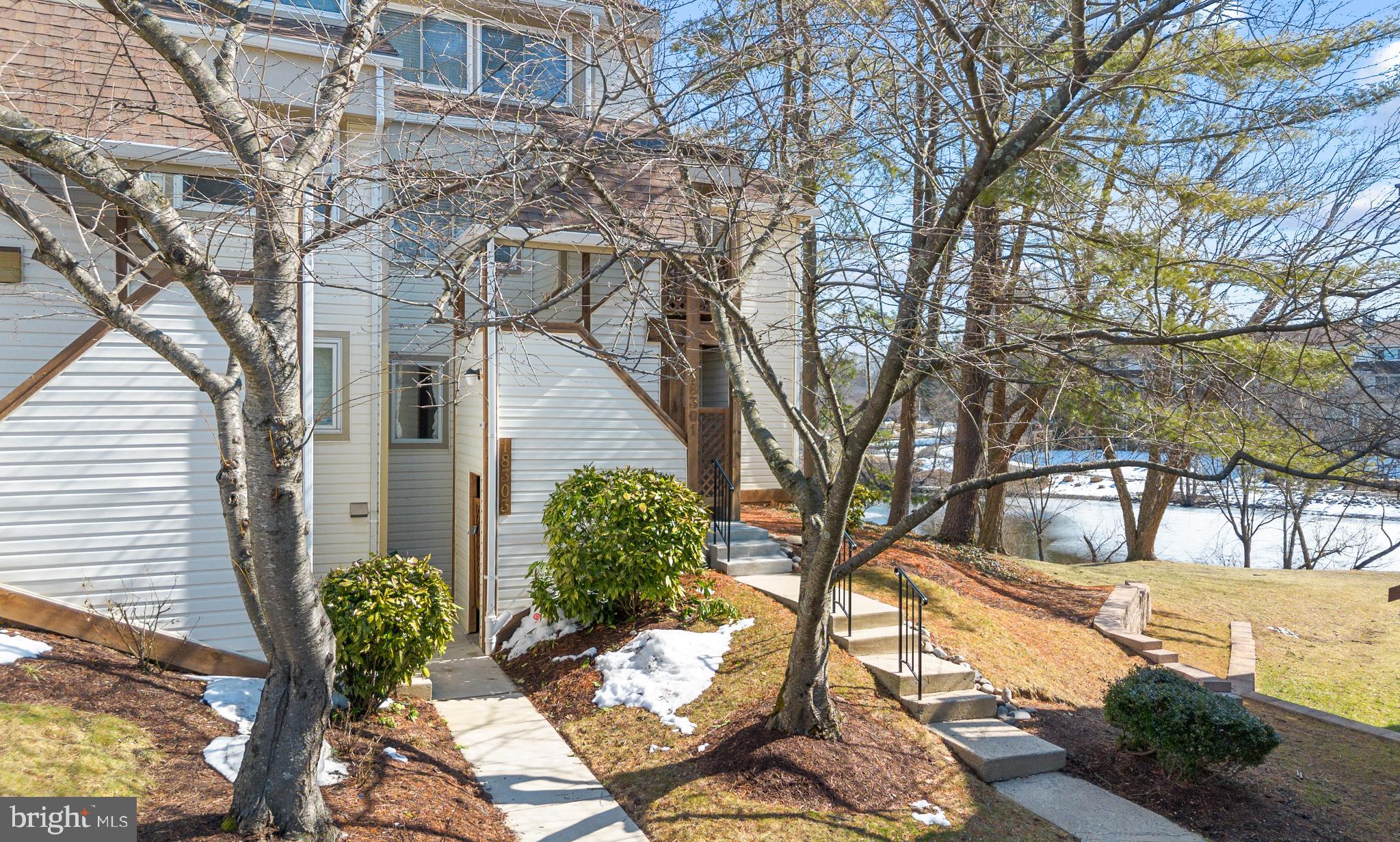 Wow! Rare lake view  end-unit townhome in the desirable Fair Hill Waterview community-A hidden gem in the heart of Olney.  Opportunities like this rarely become available in the highly sought after Waterview community. Perfectly positioned as a premium end-unit, this meticulously maintained townhome features 3 bedrooms, 2.5 baths and 1,250 square feet of bright, inviting living space, enhanced by captivating lake views and unforgettable sunrise backdrops. From the moment you step inside, you'll feel the warmth and charm of a home that has been thoughtfully cared for and designed for comfortable everyday living.  The main level showcases rich hardwood floors, a stunning marble-surround wood-burning fireplace and built-in bookcases creating an inviting environment perfect for both quiet evenings and elegant entertaining. The well appointed kitchen boasts stainless steel appliances, generous cabinetry and a stylish  breakfast bar, seamlessly flowing into the  formal dining area and the sun filled step-down living room. This open and thoughtfully designed layout offers the ideal setting for hosting gatherings or enjoying everyday comfort. Through sliding glass doors, step outside to your private patio retreat overlooking the lake, where you can relax, unwind and take in beautiful sunrise views. Upstairs, the light filled primary suite offers a peaceful retreat with its own private ensuite bath. Two additional bedrooms and second full bath offer versatile space for guests, family or a sophisticated home office. The upper level laundry with stackable washer and dryer completes the upper level with modern practicality. Residents enjoy access to Waterview's exceptional community amenities including tennis courts, pool, clubhouse, scenic walking paths around the lake and plenty of open common areas. Located in the heart of Olney, you are just minutes away from Olney's finest restaurants and premier shopping. Commuting is a breeze with easy access to the ICC, I95 and Route 108. Roofs replaced 2016, staircases 2025, balconies and pergola set to be replaced 2027. Don't miss out on this rare opportunity to own this gem-call to schedule your private showing today!