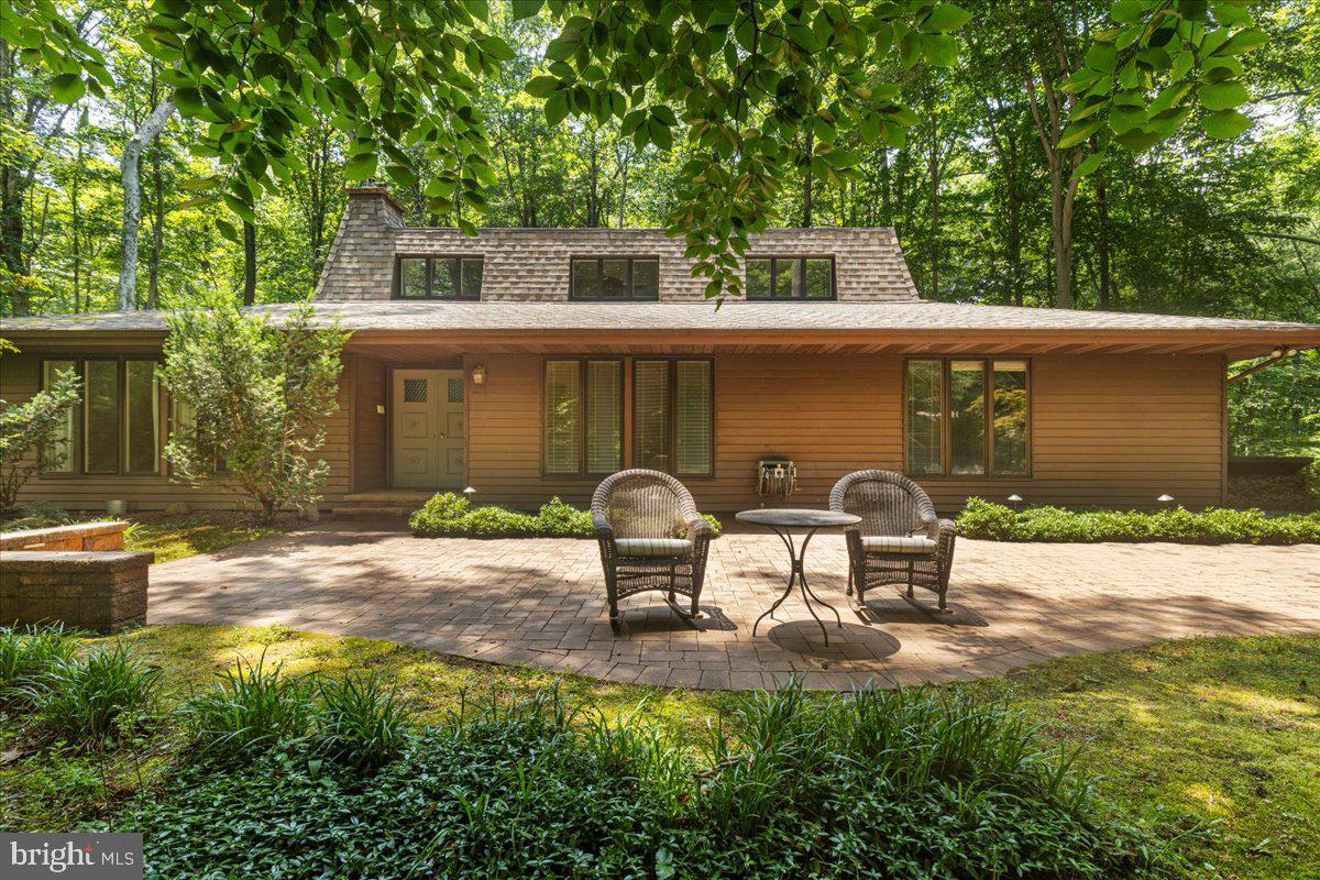 Something Out Of The Ordinary! Beautiful contemporary home nestled in the trees. Vaulted ceilings, exposed beams, skylights, gorgeous hardwood flooring throughout all contribute to the feeling of living in a very spacious tree house!  Owners suite is on the first floor along with everything else you would want, laundry half bath, great room,  kitchen with stainless appliances and lots of cabinetry along with lovely granite counter tops. Located at the end of a quiet cul-de-sac in Ferry Landing Woods.  A unique community where you really know your neighbors. Patuxent River access with pier and boat ramp , gorgeous sunsets over the Patuxent River.  There is a voluntary citizens association fee of $125 a year for use of the boat ramp.  
Two bedrooms are located on the upper level and the lower level features ample storage space lined with shelving, good size rec room with shelving , full bath and a wet bar.  If you are tired of the same old  style homes, you will be excited to sample the vibes you get when you enter this exciting home!  More information and photos to come.