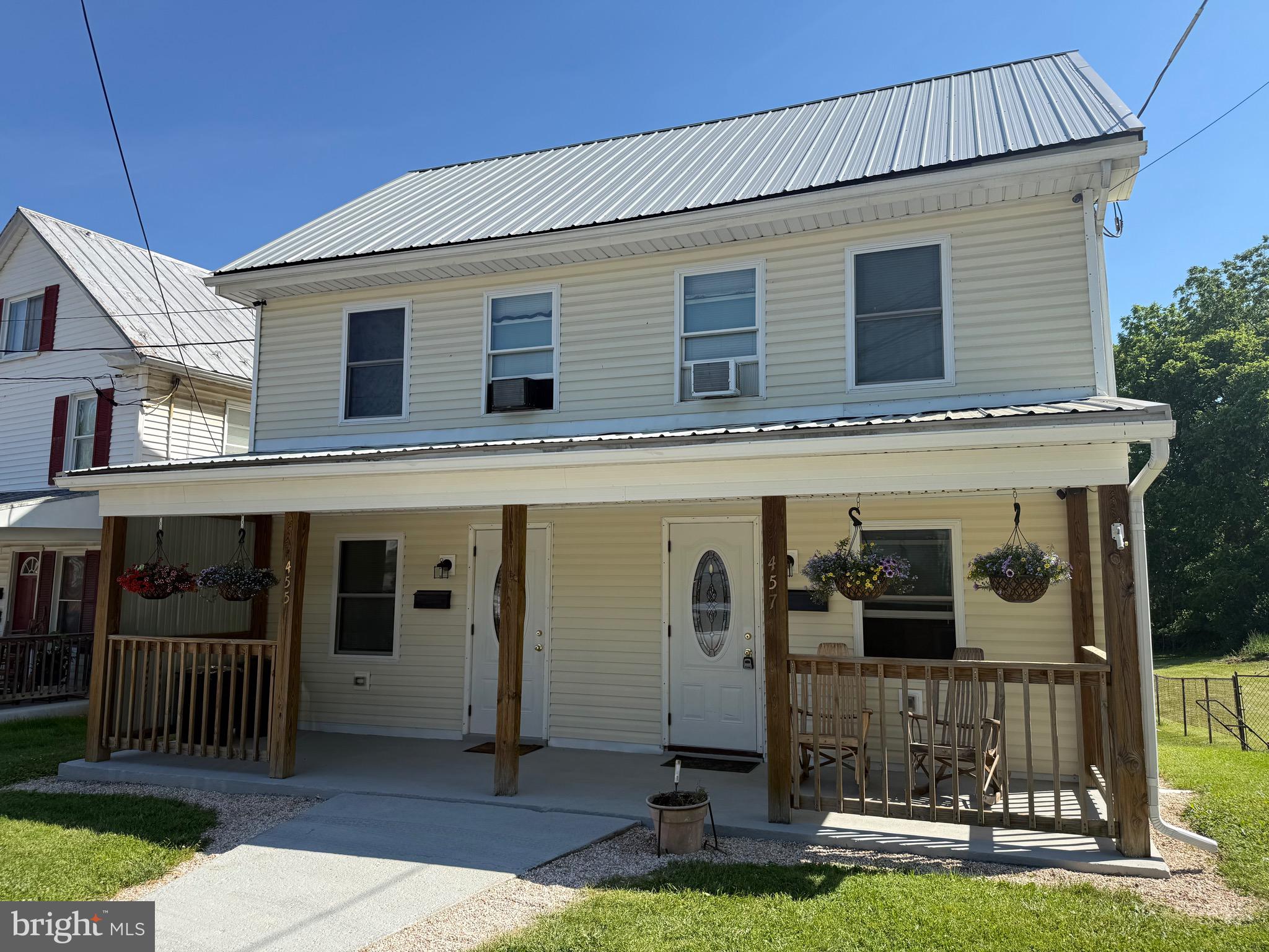 Unique investment and owner-occupant opportunity! This well-maintained duplex offers two separate units being sold together as one property, making it perfect for living in one side while generating rental income from the other. 

Unit 455 features 2 bedrooms and 1 full bath, while Unit 457 offers 1 bedroom and 1 full bath with the potential to easily convert back to a 2-bedroom layout. Recent improvements include a new roof, new siding, new windows, updated kitchen, new carpeting, and beautiful hardwood floors. 

The outdoor space is equally impressive with a private swimming-pool, a spacious end-lot location backing to an alley, plenty of parking. You'll find a 2+ car covered carport, a detached one-bay garage, and additional off-street parking options. 

Whether you're looking to expand your investment portfolio, offset your mortgage with rental income, or accommodate multi-generational living, this versatile property offers endless possibilities in a convenient Waynesboro location.