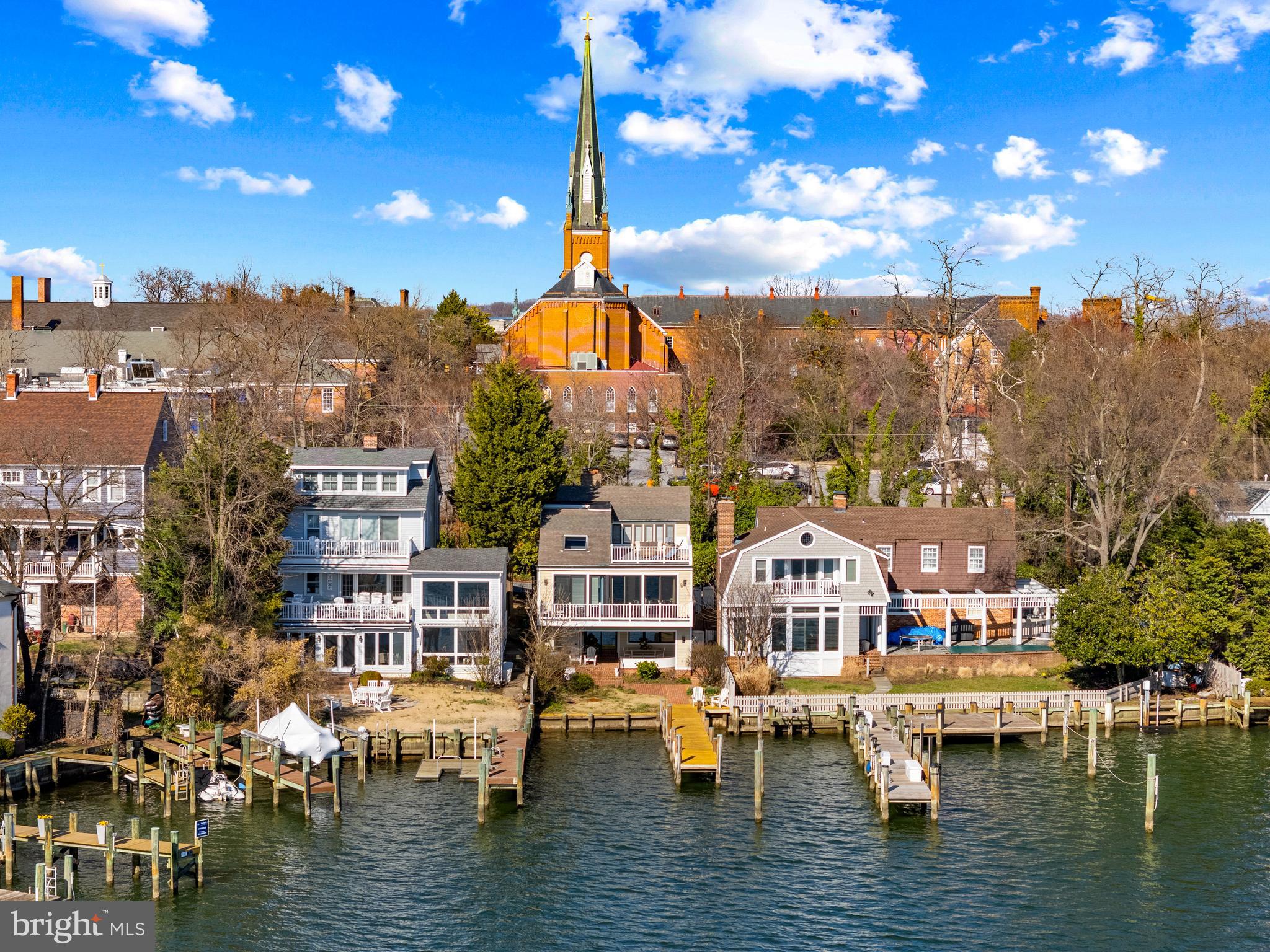 Quintessential downtown Annapolis waterfront home on the sparkling waters of Spa Creek! This amazing property combines the best of both worlds;  the charming historic feel of a downtown Annapolis home with the premier waterfront lifestyle that every resident is looking for.  Nestled on a quiet street, this home is the perfect size for an easy to own, lock up and go property. With 3 bedrooms and 2.5 baths it has all the elements needed to enjoy life to the fullest; either as the perfect weekend retreat or permanent residence. The Annapolis area and the surrounding waterways are sure to entertain in every season. The upper level of the home is dedicated to the spacious Primary suite with unique sitting area and expansive roof deck.  Take in panoramic views of Spa Creek, Annapolis Harbor and Eastport.  An unparalleled vantage point for sunrise coffee or sunset cocktails.  The main level offers multiple cozy gathering areas including a formal living room with fireplace, home office and light filled gourmet kitchen with dining area.  The kitchen area flows effortlessly into the dining area and out onto the rear deck overlooking Spa Creek.  Perfect for gathers of all sizes and dining al fresco. The lower level provides an ideal retreat for family or guests with 2 spacious bedroom a full bath and a cozy family room with fireplace.  Head out to the charming covered patio to read a book or sip your evening cocktail or venture out on the water from the private pier. The amazing location is walkable to everything Annapolis has to offer and Spa Creek provides quick access to the Chesapeake Bay and beyond. Welcome Home!