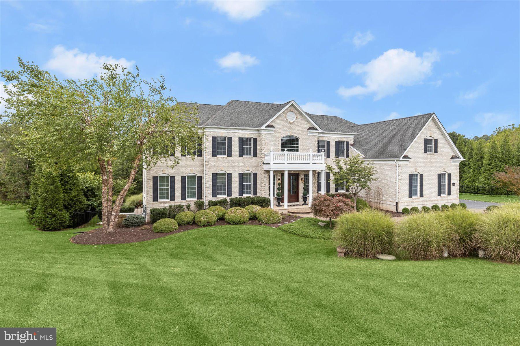 PRIVATE CUL-DE-SAC RETREAT WITH HEATED POOL, OUTDOOR ENTERTAINING
& ELEGANT INTERIORS
Exquisite Toll Brothers estate home sited on a premier 1.18-acre cul-de-sac lot in sought-after
Triadelphia Crossing. Offering 8,427 finished square feet, this exceptional residence blends
timeless elegance with modern luxury and resort-style outdoor living.
A circular drive, paver walkways, garden walls, and covered front porch create striking curb
appeal, while double entry doors open to a marble-floored storied foyer with a pair of cascading
curved staircases, and a secondary rear stair. Formal living and dining rooms flank the dramatic
central foyer, featuring tray ceilings and generous proportions, ideal for banquet sized
entertaining.
The heart of the home is the expansive gourmet kitchen, complete with professional Monogram
appliances, a gas cooking station with custom hood, granite counters, designer tile backsplash,
commanding center island with prep sink, two breakfast bars, walk-in pantry with organizer
system, and dual beverage coolers. Adjacent breakfast and morning rooms both offer abundant
natural light, atrium access to the composite deck and access to a screened gazebo for additional
gathering space. A coffered ceiling crowns the two-story family room that is defined by columns
and a central fireplace creating a grand yet inviting focal point adjacent to the kitchen. The main
level also features a private study, sun-filled conservatory, and a main-level bedroom with a full
bath and balcony access, perfect for guests or multigenerational living. California Closet
organizers enhance storage and closets throughout, and two laundry centers provide added
convenience.
Upstairs, the luxurious primary suite showcases a tray ceiling, spacious sitting room, a spa-
inspired bath, and an oversized bonus walk-in closet large enough to accommodate the finest
clothing and shoe collection. The upper-level laundry conveniently services all four ensuite
bedrooms including the primary bedroom, a private guest suite and two additional en-suite
bedrooms, each outfitted with private sitting areas, closet organizer systems and private attached
baths.

The finished, full-daylight walk-out lower level is designed for entertaining, and flexibility
featuring a large recreation room, exercise/game area, media/flex room, guest quarters, full bath,
wet bar with full-size ice maker, and extensive unfinished storage with another bath rough-in,
and spaces with full daylight windows adding potential for an additional bedroom and bath.
Outdoor living rivals a private retreat with a heated in-ground pool featuring three water
fountains, composite deck, rear balcony, screened gazebo, walk-out patio, extensive hardscaping,
and professional landscaping. Buried propane services the heated pool, fireplaces, heating inside,
and cooking.
Luxury and convenience at every turn includes a three-car side-loading garage, cozy gas heat,
central AC, and a water conditioning system for well and septic. Conveniently located within the
Bushy Park, Folly Quarter, and Glenelg school districts, this rare offering of refined interiors,
freshly painted, with new carpet (2025) combines exceptional amenities, and an unparalleled
setting. This home is truly a standout that will impress the most discerning buyer. Come home to
luxury, privacy and elegance all at once!
