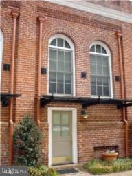 Sophisticated 3 level TH in historic "Brewery". 12' ceilings on the main level, wood floors throughout, fireplace in LR, cherry cabinets, granite counter tops. Jacuzzi, brick patio, MBR terrace, walk-in closets, garage parking. Great location with easy access to airport, DC, & Old Town. Storage unit in garage. Pets, 25 lbs or less, case by case with an extra deposit.