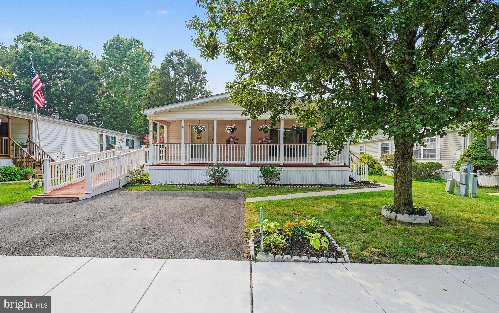 Affordable move-in ready opportunity! Located in the desirable 55+ community of Cecil Woods, 2 bedroom, 2 bath manufactured rancher ("Severn" model) featuring a sprawling covered front porch that includes a new ramp, with close proximity to Rt 40, I-95 and shops and restaurants of the quaint and historical town of North East, Maryland. Highlights include and open and airy floor plan with crown molding, vaulted ceilings and new neutral carpeting throughout. Kitchen details include white cabinetry, propane cooking, new sink/faucet, skylight and loads of storage and prep space. Additional details include 2 bedrooms (both with walk-in closets), including a primary with an attached bath as well as a second full bath and laundry/utility room with exterior access. Upgrades include new HVAC with a transferrable warranty added in 2025, newer water heater, ramp (2024) and new carpeting added in 2024. The active community center features a large clubhouse that includes a kitchen, social gathering area, library, billiards, exercise room, party room/game room and walking/jogging paths. Ground rent is $665.00 monthly (no property taxes!) and includes trash pick-up, public sewer and snow removal on the streets. Buyer must receive park approval from Cecil Woods (see documents for application). If you are searching for a well priced, move-in ready home located in a peaceful, friendly and active community, your search is over... 73 Woods Way... Welcome HOME!!!