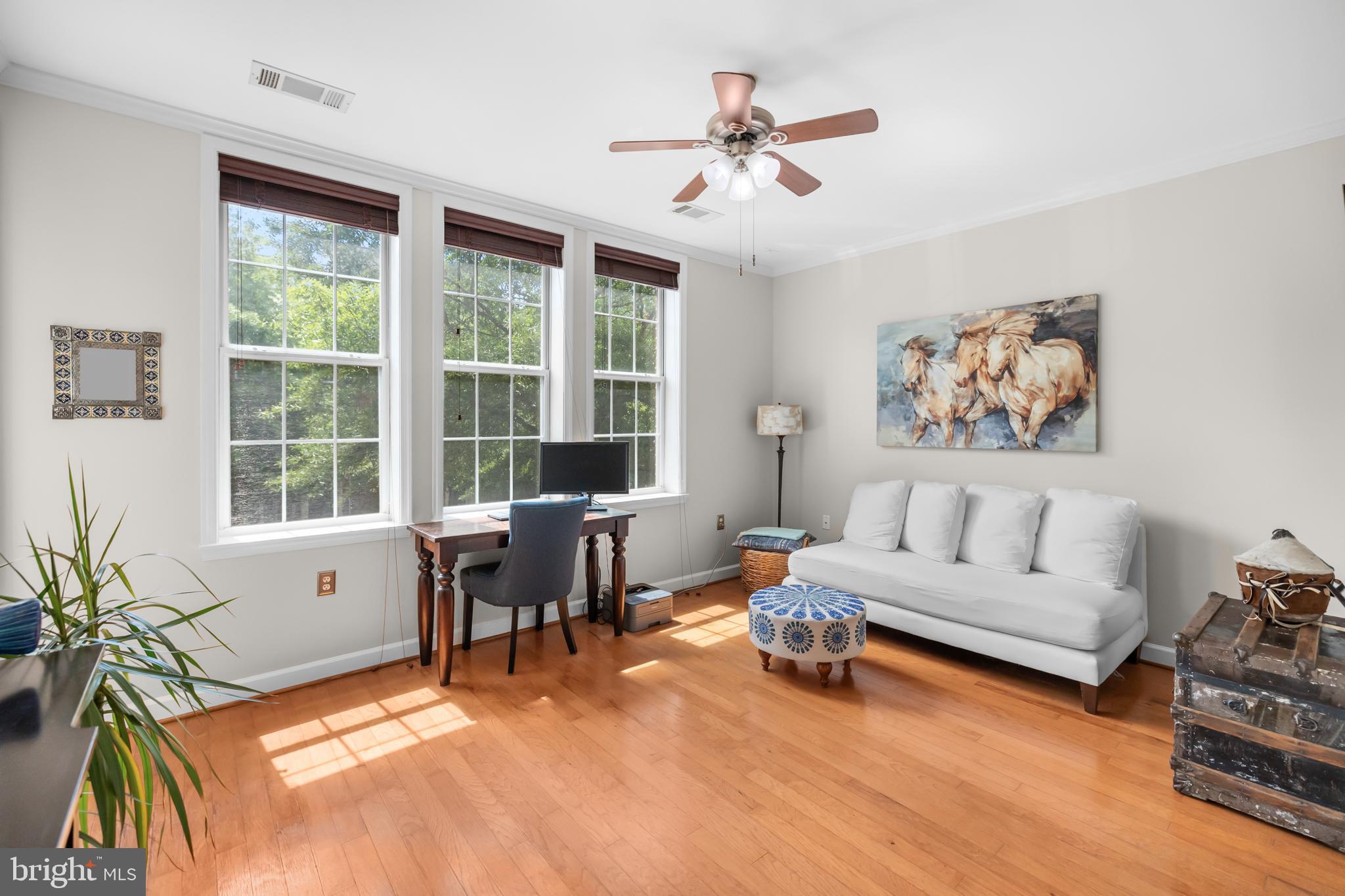 This beautiful condo, located on the sunny side of the building, is filled with natural light and features hardwood floors throughout, fresh designer paint, and a spacious kitchen with maple cabinetry, granite countertops, and stainless steel appliances. A cozy balcony off both the living room and bedroom offers the perfect spot for morning coffee. The furnace was replaced in 2021 and the water heater in 2015, and the unit includes two underground garage spaces, #24 and #75. Thoughtfully designed building featuring 2 elevators, secure package room, office/library with internet, computers and printer, center courtyard with fountain, library, fitness center, manager on site, bike storage and secured entry. Cameron Station offers a unique community close to everything! Community center with basketball courts, fitness center, outdoor pools, meeting rooms plus so much more walking distance. Brick sidewalks, colonial street lamps, pocket parks plus local businesses steps away from your front door. Free shuttle bus to Van Dorn Metro Station, close to 395/495/95, minutes to Old Town Alexandria, DC and Washington Reagan Airport.