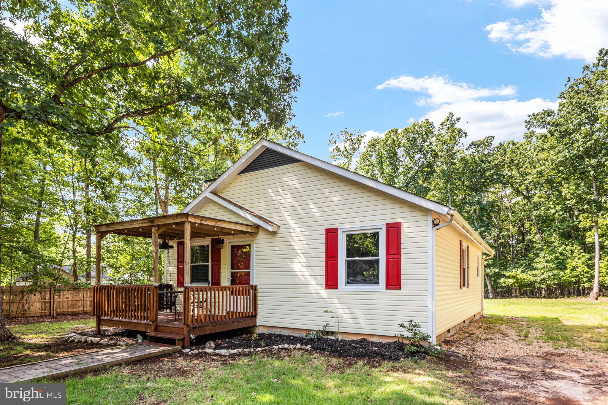 Welcome to 15012 Comfort Lane!  Sitting on  1.43 acres, this cute water access home is the perfect lake getaway.  Don't let the square footage fool you.  This house offers lots of space.  

Enter  the house through the front door under the covered front porch into the living room.  A great line of sight to the back of the house.  The living room has a fireplace to enjoy for the cooler days to come.  There is a coat closet tucked behind the front door.  The living room is open to and  flows into the dining area which is open to the kitchen.  The kitchen offers lots of counter space and plenty of cabinets.  The back door off the kitchen leads out to the back porch which is also covered.

Back inside the two bedrooms are down the hallway, one in each direction.  Each bedroom accomodates a queen size bed and  additional furniture.  Each room has a good size closet.   There are two additional closets in the hall.  One for linnen.  The other for storage of any kind.  The bathroom is near the bedrooms.  It has a tub shower combination and is  large enough to house the washer and dryer. 

Outside to the 20x40 metal garage with roll up door.  The garage has electricity.  It offers plenty of room to store your boat, mower, cars, or just about anything.  Right next to the garage is a shed which also has electricty.  Are you looking for a workshop?  The shed is the answer.   Attached to the shed is an out door shower.

The neighborhood common area is just around the corner.  There is a boat launch for easy access to the lake.  Boat all day and take your boat home to keep it n the garage.  Spend time in the community pavilion or on the volleyball court.

Don't miss out on this great property and don't be fooled by the square footage.  This home is laid out well and with the addition of the garage there is plenty of room!  This house is a great way to get started with a lake home and plenty of room to expand down the road.