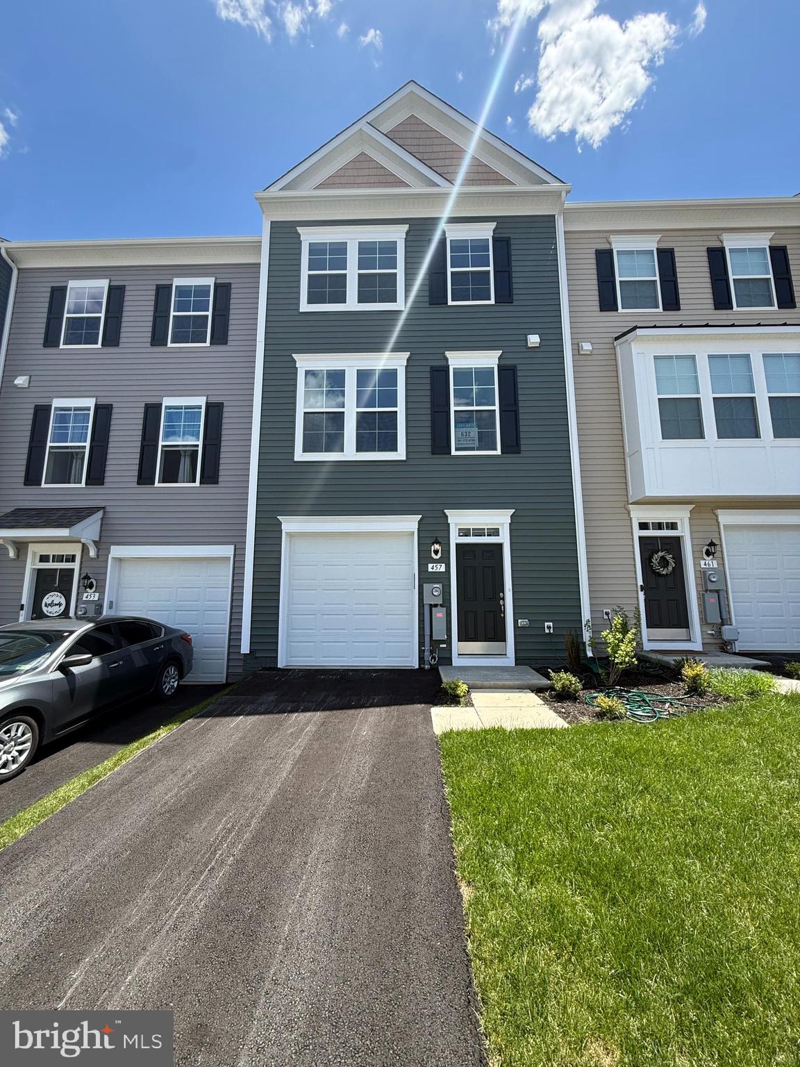 Welcome home to Berkeley County’s Martinsburg Station community, offering exceptional amenities including a clubhouse, swimming pools, scenic walking trails, lush landscaping, and breathtaking mountain views.
This  beautifully designed three-level townhome featuring a one-car garage, 3 bedrooms, and 3.5 bathrooms. A charming covered front porch welcomes you into the spacious lower level, complete with 9-foot ceilings, a foyer with a double coat closet, garage access, and a fully finished recreation room with a full bath and walkout access to the rear yard with privacy fencing.

This home includes a three-level morning room extension, The open-concept main level features 9-foot ceilings, luxury vinyl plank flooring, a dedicated dining area, and a stunning kitchen equipped with stainless steel appliances, an oversized 8+ foot island, upgraded  cabinetry, and quartz countertops. The kitchen flows seamlessly into the spacious living room and conveniently located powder room.

Upstairs, the primary suite offers large walk-in closet, and a luxurious en-suite bath , a tiled shower, and a separate soaking tub. Laundry is conveniently located on the bedroom level for added ease.
A must see!