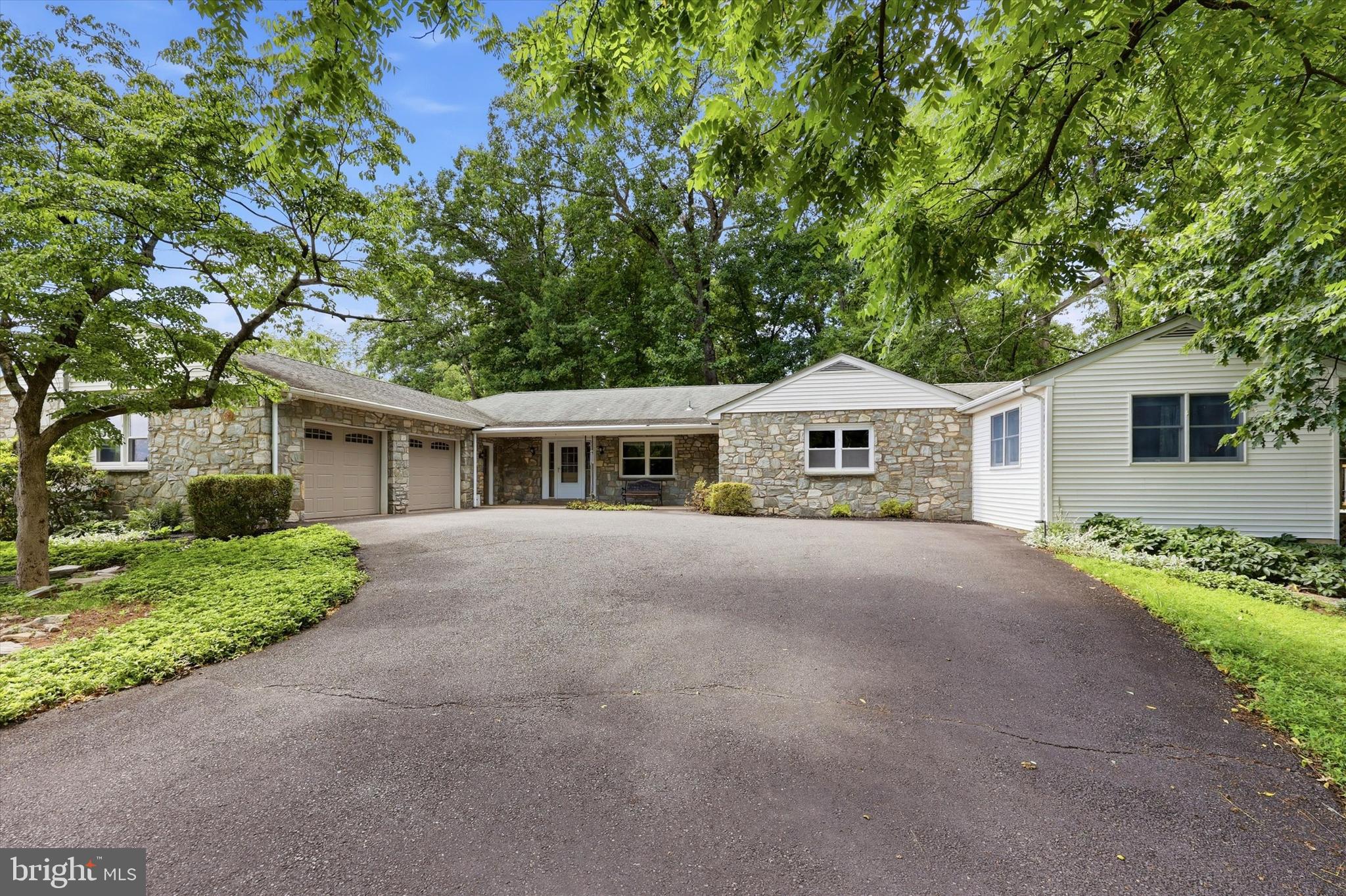 Welcome home to this expansive 4-bedroom, 3 full bathroom ranch nestled on just over 3 picturesque acres, offering the perfect blend of space, flexibility, and privacy. Designed with comfortable everyday living and effortless entertaining in mind, this home features an inviting open layout with generously sized rooms and abundant natural light throughout.

The spacious kitchen offers extensive cabinetry, a center island, and opens seamlessly to the dining area, making it the heart of the home. The oversized living and family rooms provide multiple gathering spaces, highlighted by a cozy fireplace and walls of windows overlooking the peaceful wooded surroundings.

The primary suite offers a private retreat with an ensuite bath, while the additional bedrooms are generously sized and well-appointed. A dedicated home office or sunroom provides the perfect space for remote work, hobbies, or relaxing while enjoying the surrounding nature.

One of the home's standout features is the private in-law suite, complete with its own separate entrance, kitchenette, full bathroom, deck, and living space ideal for multigenerational living, extended guests, or an au pair.

Step outside to enjoy the beautifully landscaped grounds featuring a flagstone patio, spacious rear deck, and plenty of room to entertain, garden, or simply unwind while taking in the tranquility of your own private retreat.

The finished lower level offers even more living space with a large recreation room, fireplace, built-in shelving, and endless possibilities for a media room, game room, fitness area or powder room.

With over three acres of land, an exceptional floor plan, spacious living areas, and a versatile in-law suite, this one-of-a-kind property offers the privacy of country living while still being convenient to shopping, dining, and major commuting routes.

This is a rare opportunity to own a home that offers exceptional space, flexibility, and privacy all on a beautiful piece of land. Schedule your private tour today!
