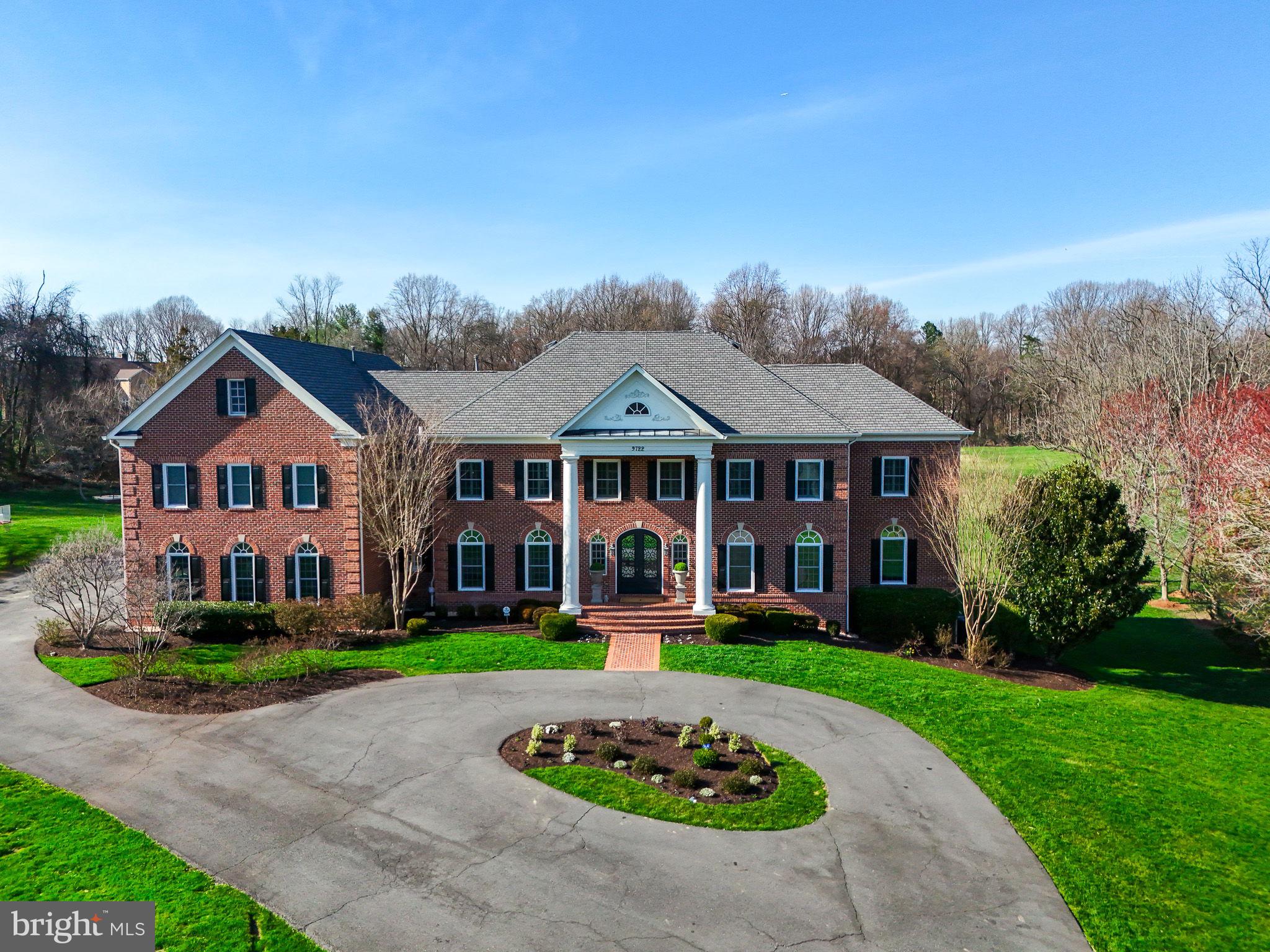 Property is under contract OPEN HOUSE HAS BEEN CANCELED!!


Welcome to the luxurious estate at 9722 Arnon Chapel, where elegance meets grandeur on sprawling 5 acres of landscaped grounds.

This meticulously renovated Georgian colonial exudes architectural mastery, reminiscent of the finest properties across the country. As you step inside, you’re greeted by a grand twin staircase, a testament to the home’s grace and style.

The interior boasts opulent details, including intricate molding, pristine hardwoods, and tasteful built-ins at every turn. The formal dining room, adorned with twin chandeliers and an elegant fireplace, is perfect for hosting diplomatic gatherings.

At the heart of the home lies the gourmet kitchen, a culinary delight and gathering place for creating cherished family memories. The spacious breakfast room seamlessly opens to the family room, featuring coffered ceilings and a striking stone fireplace.

Outside, a covered patio with a dual-sided fireplace offers a serene retreat for alfresco dining or relaxation.

The second level reveals an expansive suite, complete with a fireplace, sitting area, and closet of unparalleled proportions. Access to the expansive elevated deck provides sweeping views of the grounds. The luxurious en suite bathroom features white marble floors, a freestanding tub, and a spacious shower with dual shower heads. Additional bedrooms, each with its own en suite, provide ample space for family and guests.

Venture to the lower level to discover a wealth of amenities, including a wine cellar, home theater, and a fully equipped kitchen and bar area. A bedroom with a private entrance offers flexibility and convenience for guests or live-in staff.

Situated in the prestigious Great Falls area, this remarkable property is practically walking distance to the village, offering both convenience and easy access to major corridors.

In summary, this estate offers a rare opportunity to experience luxury living at its finest. Optional pool adds to the allure of this magnificent property.