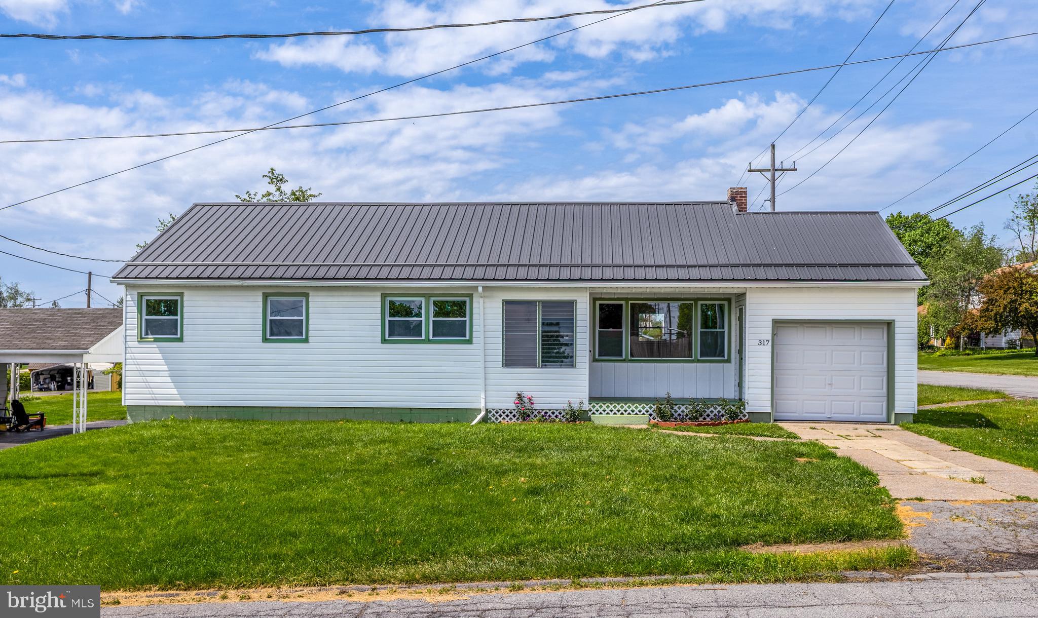 OPEN HOUSE - Sunday, June 7th from 12:00 - 1:30pm. Step into this timeless Chester Hill Borough ranch home bursting with charm. This 1950’s style house is beautifully renovated and perfectly blends classic character with stylish modern updates. Cute as a button and move-in ready, the 3-bedroom, 1-bath home sits on a spacious corner lot directly across from a park and just a short walk to local schools.

Put away the toolbox, this house has a new metal roof, new windows, laminate flooring, fresh neutral paint throughout, new interior doors and trim, updated lighting, new smoke alarms, and a professionally inspected and cleaned boiler with all new heating baseboards. The inviting kitchen shines with custom painted cabinetry, butcher block countertops, stylish green and natural wood tones, and all new appliances. The renovated bathroom includes a new shower, toilet, and fog-free mirror for a modern touch.

Natural light pours throughout the home, highlighting the warm and welcoming spaces. Enjoy outdoor living on the covered back patio overlooking the large yard with fresh landscaping and updated exterior paint. Additional features include a one-car garage with an automatic opener, full unfinished basement with walk-up access to the backyard, a new sump pump, and a full walk-up attic offering incredible storage space.

Full of charm, thoughtful upgrades, and modern style, this adorable ranch is ready to welcome its next owner home!

Listing Agent related to Seller.