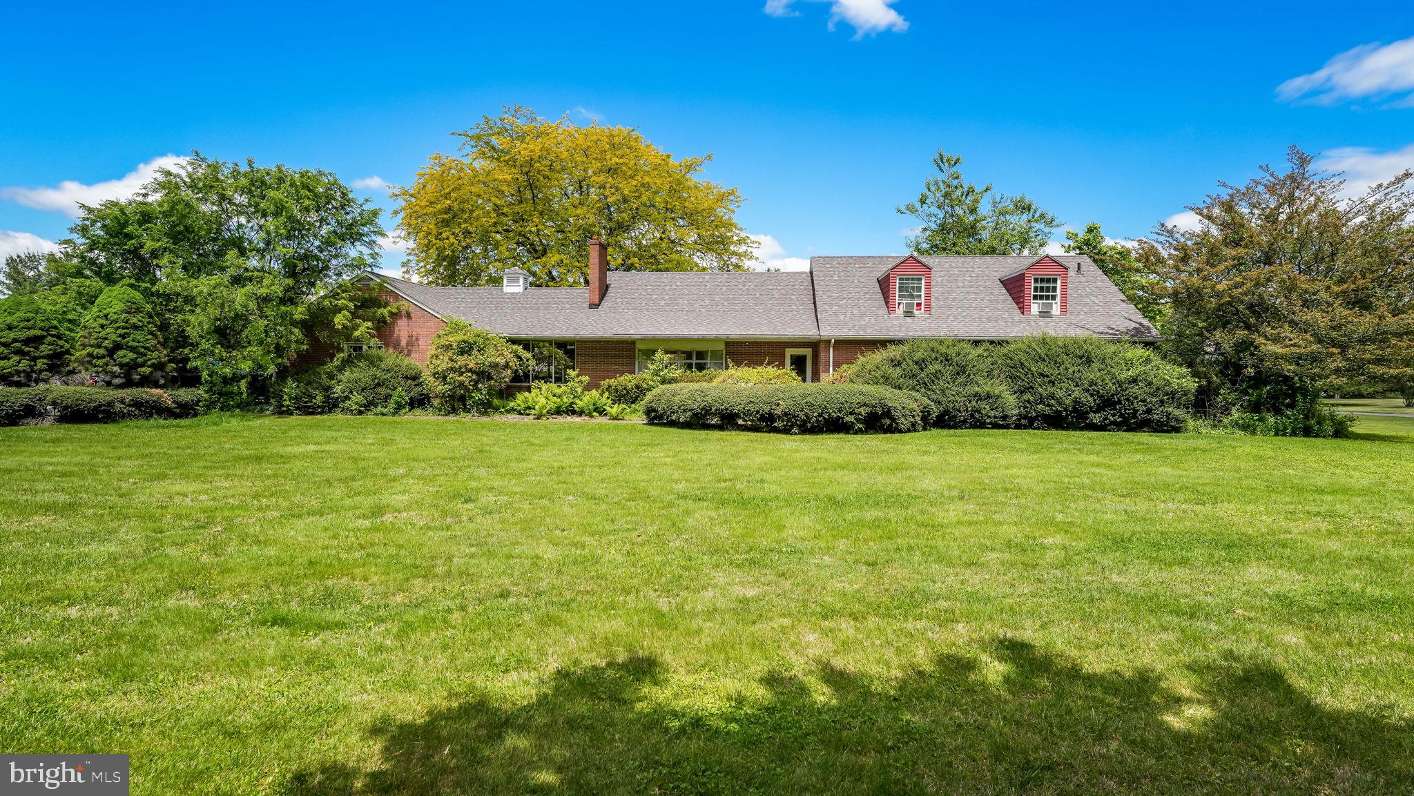 Welcome to 1591 Middletown Road, a truly rare opportunity to own one of Gradyville's most distinctive estate properties. Custom built in 1959 by Edward Culbertson, its original owner and craftsman-builder, this expansive all-brick ranch remained in the same hands for over five decades before being purchased by the current owner in 2012. Now, for only the third time in its history, this remarkable property is ready for its next chapter.

Situated on approximately 3 picturesque, level acres, this sprawling residence offers over 3,700 square feet of above-grade living space featuring 5 bedrooms, 3 full bathrooms, and 1 half bath (located in the pool house). The home's impressive footprint, solid construction, and timeless design provide an exceptional foundation for modernization while preserving its original character and craftsmanship.

As you arrive, you'll immediately appreciate the estate-like setting and abundance of parking and storage options. In addition to the attached 2-car garage, the property boasts a massive detached oversized garage capable of accommodating 4+ vehicles, making it ideal for car enthusiasts, contractors, hobbyists, or anyone seeking exceptional workspace and storage.

The backyard is an entertainer's dream, highlighted by a rear rick patio that leads down to the stunning in-ground saltwater pool reaching depths of up to 9 feet, complete with an accompanying pool house featuring a convenient half bath. Recent pool improvements completed in 2025 include resurfacing, new tile, coping, heater, light, and filter, creating the perfect setting for summer gatherings and years of enjoyment ahead. Additional recent updates include a new roof installed in 2025 and a new well pump installed in 2026. (Pool heater wiring replacement needed.)

Properties of this size, setting, and pedigree rarely become available. Whether you're seeking multi-generational living, space for hobbies and recreation, or simply the opportunity to create a one-of-a-kind estate, this home offers endless possibilities.

Bring your vision and imagination—this isn't just a home; it's a blank canvas waiting for its next masterpiece. With incredible bones, unmatched space, and nearly three acres of prime ground, the foundation has already been laid for another 50-plus years of memories. The next owner won't simply be purchasing a property—they'll be continuing a legacy and writing the next extraordinary chapter in the story of this Gradyville landmark.  This is strictly an as is sale, seller will not make any repairs or credits for repairs.  Buyer to handle any local township requirements for Use and Occupancy.