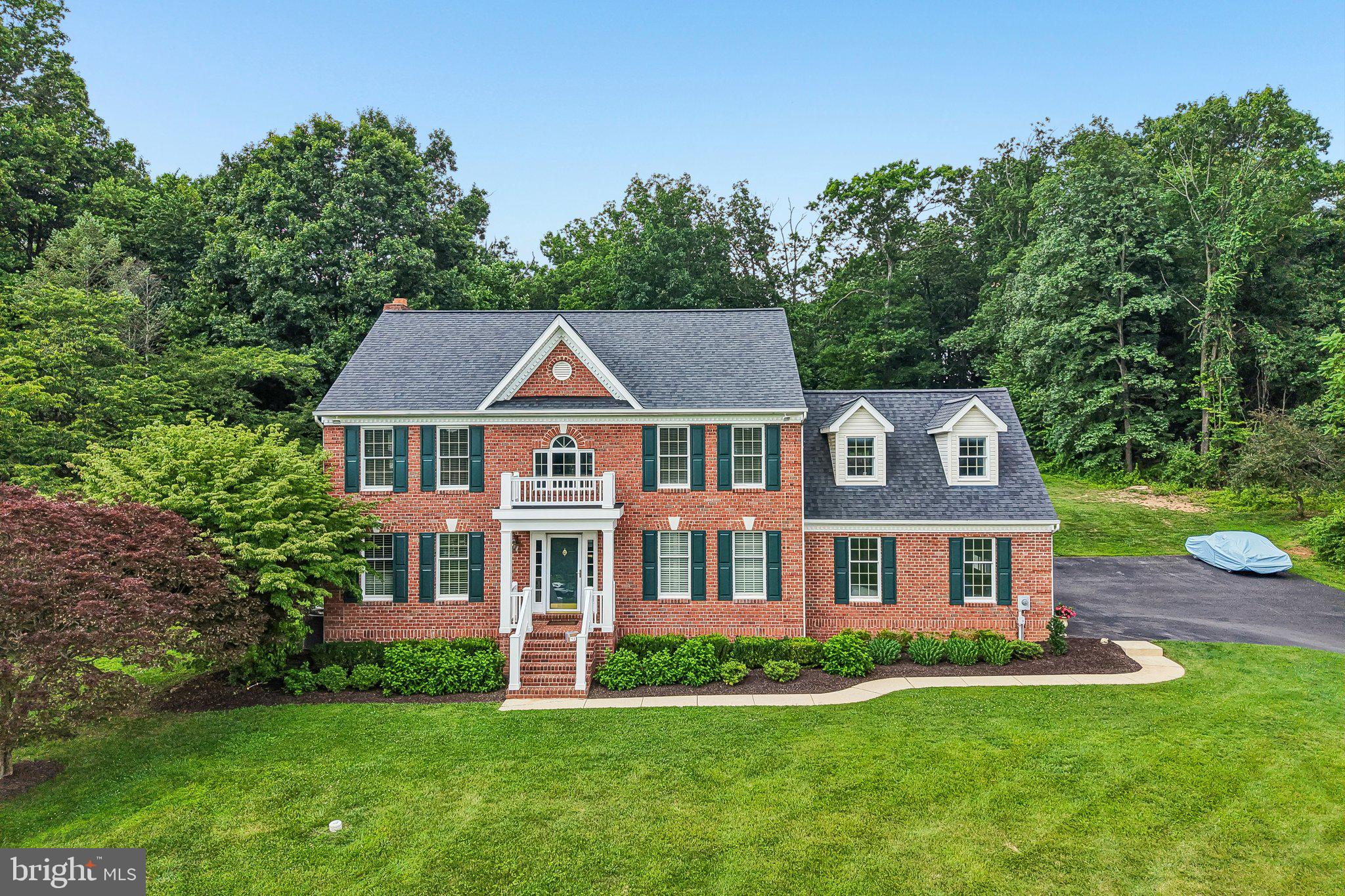 Welcome to 17706 Foxmoor Drive, where timeless elegance meets resort-style living on 3.40 private acres in sought-after Woodbine, Howard County. This spacious brick-front colonial offers over 3,000 finished SF of beautifully maintained living space filled with natural light and picturesque views from every window or balcony. The heart of the home features generous gathering spaces perfect for everyday living and entertaining, while the updated bathrooms provide modern comfort and style. Step outside to your own backyard oasis featuring a built-in swimming pool, expansive patio, and peaceful surroundings that make every day feel like a vacation. The finished lower level offers a brand-new full bath, incredible flexibility for a home gym, recreation room, children's playroom, media space, or entertaining area complete with room for a bar. Enjoy the perfect blend of privacy, space, and convenience with beautifully landscaped grounds, spacious rooms, expansive driveway and endless opportunities for indoor and outdoor entertaining. This exceptional property delivers the lifestyle you've been waiting for. Schedule a personal tour starting July 8th!
