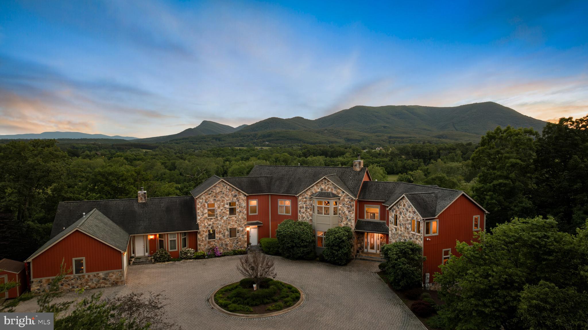 Priced BELOW Assessed Value! 
Nestled atop the Shenandoah Valley with breathtaking views of Massanutten Mountain and the North Fork of the Shenandoah River, this stunning 22-acre estate boasts 964 feet of riverfront, 15 acres of pasture, 6 acres of forest, and a naturally fed pond perfect for fishing, hunting, and picnics.

Designed for versatility, the property features two distinct homes under one roof, ideal for multi-generational living, short-term rentals, or combining private and business spaces. With over 10,000 sq. ft. of total space, amenities include expansive decks, an above-ground pool, and a finished basement with office and entertainment areas.

Whether you’re captivated by the panoramic views, the opportunity for subdivision, or the blend of luxury and practicality, this estate offers endless possibilities. Pasture near the river is in a flood zone. Flood insurance is not required. Neighboring properties have horses on pasture, but permanent structures can not be built in the flood zone. Fencing, camping platforms, etc can. Right of way from the paved road onto this property.  Internet can be Star Link or other satellite options. 

Schedule your private tour today and experience the Shenandoah Valley lifestyle!
