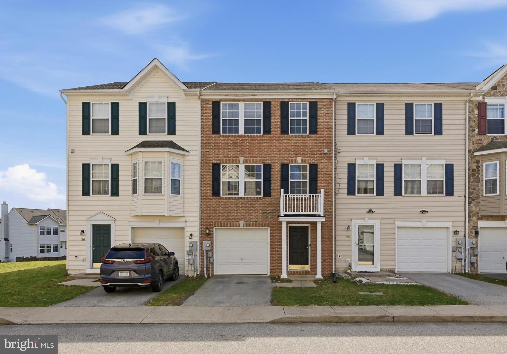 Move-in ready, this townhome features neutral interior paint that provides a clean backdrop you can easily make your own, along with a comfortable three-level layout that feels easy to settle into. The brick front exterior adds timeless curb appeal and low-maintenance living. The walk-in entry level includes a welcoming foyer, laundry room, access to the fenced rear yard, and interior entry from the attached one-car garage for everyday convenience.
The main living level is designed for gathering and offers a spacious living room, powder room, and an eat-in kitchen with breakfast nook. New modern LVP flooring extends throughout the foyer, main living room, and powder room, while new plush carpet with upgraded padding adds comfort throughout the stairs and upper level.
Upstairs, the spacious primary suite features a private en-suite bath with double vanity, soaking tub, and separate shower, along with two additional well-sized bedrooms and a full hall bath.
Outside, the fenced rear yard provides functional outdoor space, with a community tot lot and playground nearby.