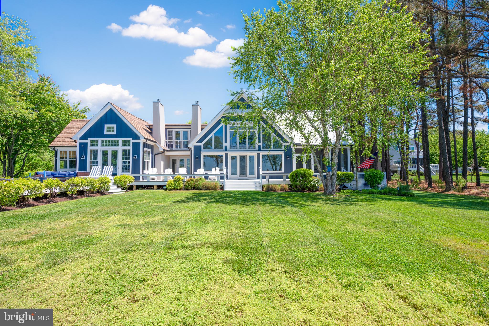 Experience sweeping western-facing views of the Chesapeake Bay from this beautifully renovated waterfront retreat in Tilghman Island. Thoughtfully redesigned and updated in 2023, this exceptional property seamlessly blends refined coastal living with the tranquility and natural beauty of its extraordinary waterfront setting.
Inside, the light-filled great room is the heart of the home, with soaring vaulted ceilings, a gas fireplace, dramatic floor-to-ceiling windows that capture breathtaking panoramic water views, and stunning sunsets. Every detail of the renovation was carefully considered to enhance both comfort and connection to the outdoors, including the addition of a screened porch with vaulted ceilings and its own fireplace—an ideal space for year-round waterfront entertaining and relaxation.

The first-floor primary suite offers a private sanctuary overlooking the Bay, complete with expansive water views, a spacious en suite bath, and generous walk-in closets. Designed for effortless indoor-outdoor living, the home also features low-maintenance composite decking, multiple waterfront gathering spaces, and a heated gunite pool perfectly positioned to enjoy the surrounding scenery.

For boating enthusiasts, the property is equally exceptional. A private dock equipped with a boat lift and jet ski lift provides immediate access to some of the Eastern Shore’s finest boating, fishing, and waterfront destinations. The protected rip-rapped shoreline adds both beauty and peace of mind.

This is a rare opportunity to own a turnkey waterfront escape offering luxury, privacy, and unforgettable Chesapeake Bay sunsets—all within the laid-back charm and timeless appeal that make Tilghman Island so special.