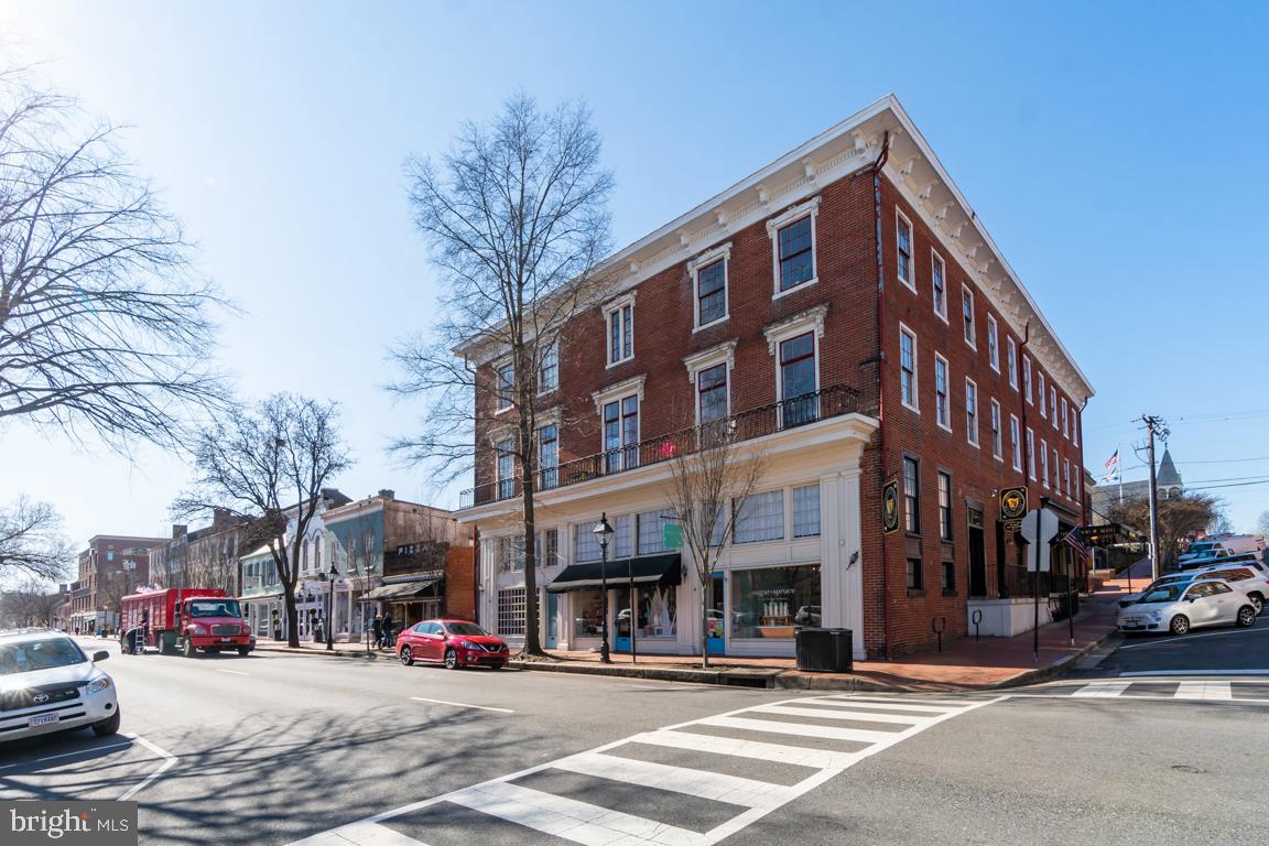 Multi-unit mixed use commercial/residential building in the heart of Downtown Fredericksburg. 1,510 SF of above grade restaurant & pub space in J Brian s Tap Room, 1998 SF of retail space in Sugar + Spruce, and 9 apartment units which are all currently rented. J Brian s Tap Room features hardwood flooring throughout with a pub with a long wooden bar and tables, and a dining area with booths and tables. Brick patio access includes street views and sitting areas, as well as a courtyard in the rear which includes a large brick patio and additional seating. The Tap Room includes 1,171 SF basement space with private office, prep area, and storage.Each apartment unit has its own heating and central cooling units by heat pumps with the exception of the top floor units which have gas heat. The tenants pay their own utilities and the landlord pays water, sewer, trash pick-up, common area maintenance, and common area electric and gas. Approximately 66.4 feet of frontage along Caroline Street and 103.3 feet of frontage along Hanover Street. The subject s location at the corner of Caroline Street and Hanover Street offers good exposure to vehicular and pedestrian traffic. Access is provided by street parking only.