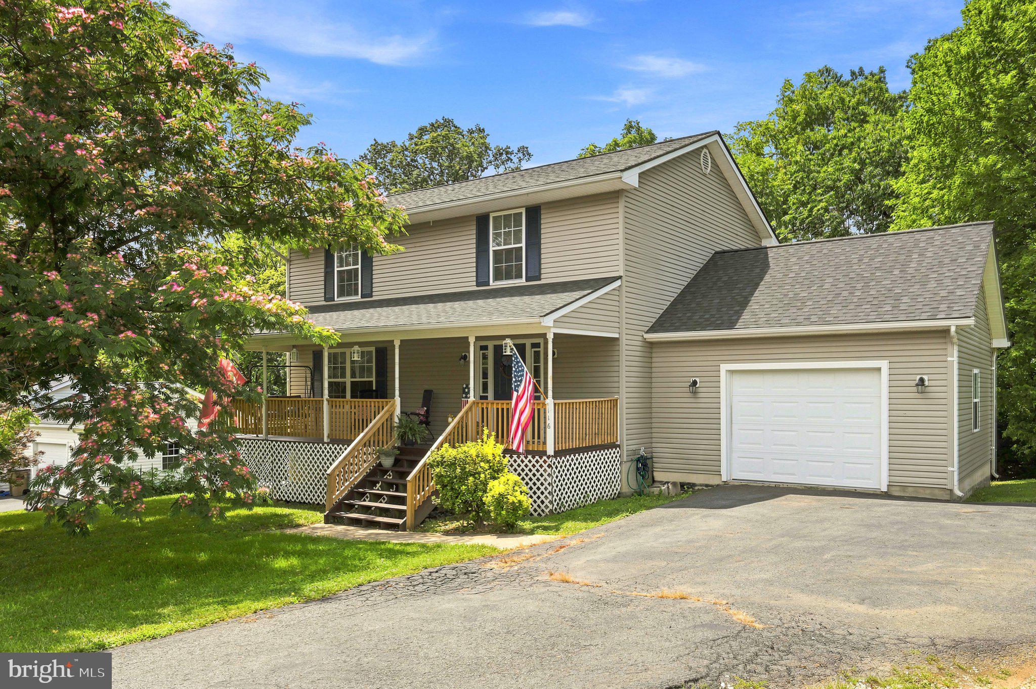 Well-maintained Colonial with beautiful mountain views and numerous recent updates! Relax on the spacious covered front porch or entertain on the newer rear deck (approximately 4 years old) overlooking the large, landscaped backyard featuring a fire pit and mature trees.

Inside, you'll find fresh neutral paint in some areas and a welcoming foyer with a coat closet. The main level offers a spacious living room, bright dining area with access to the rear deck, a convenient laundry room off the kitchen, and a half bath. The kitchen is equipped with stainless steel appliances, including a new dishwasher (2026), new garbage disposal (2026), new stove and vent hood, and an oven approximately 3 years old.

Upstairs, the spacious primary suite features a ceiling fan, window blinds, walk-in closet, and private en-suite bath. Two additional generously sized bedrooms, each with ceiling fans, share a full hall bath with a tub/shower combination.

The fully finished walk-out basement provides exceptional additional living space with a large family room, bar area, fourth bedroom with exterior access, and a full bath. The pool table, bar, and TV wall mount all convey with the property.

Additional improvements include a new roof installed in August 2025, making this home truly move-in ready. Offering abundant indoor and outdoor living space, scenic mountain views, and thoughtful updates throughout, this beautiful home is ready for its new owners!
