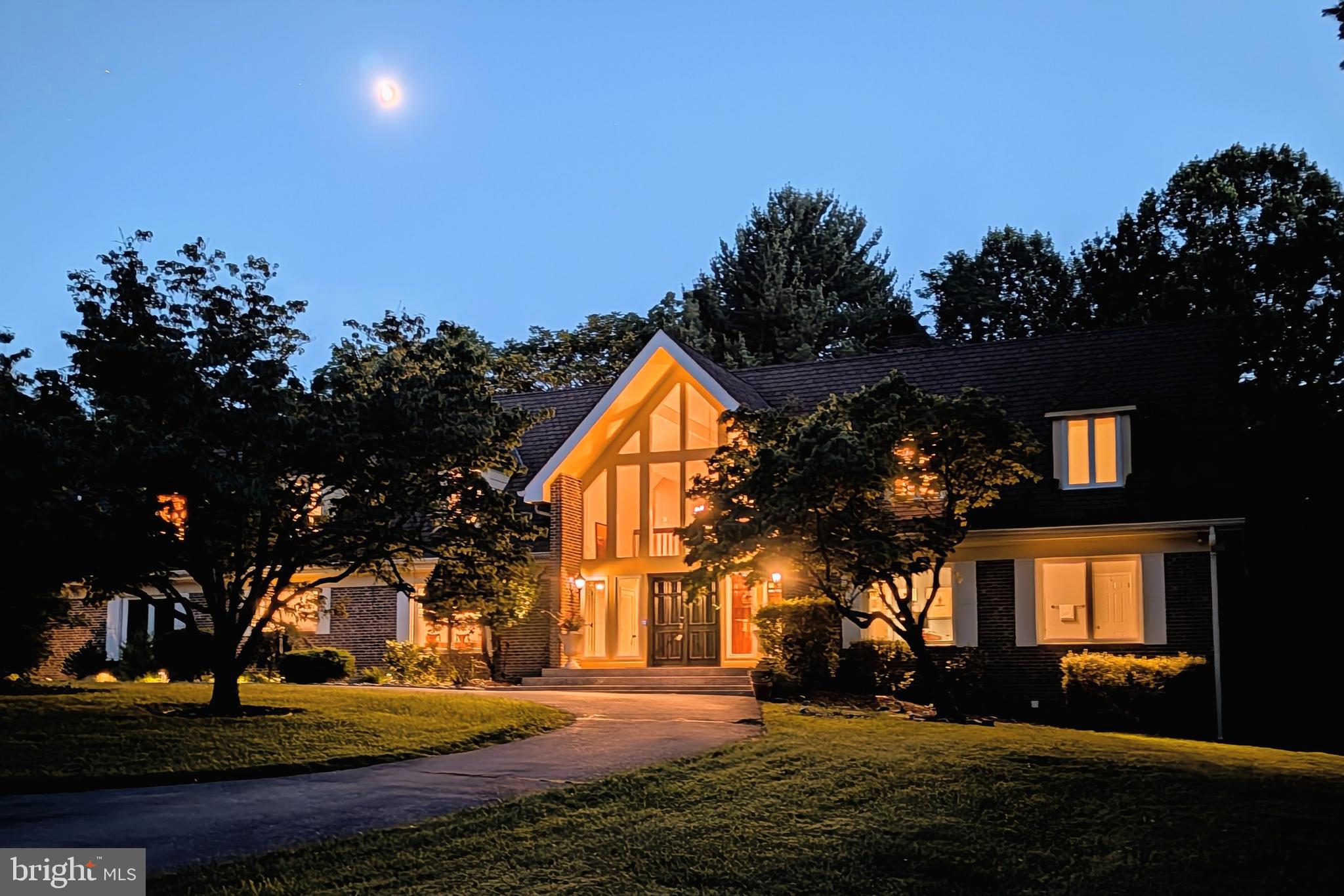 PRICE IMPROVEMENT! Nestled on a 2-acre private lot just minutes from the heart of Potomac Village, this chalet-inspired home is a seamless blend of sophisticated design and contemporary luxury. Every inch of this home has been thoughtfully designed for both serene everyday living and unforgettable entertaining.

Step inside to discover soaring ceilings and a two-story family room bathed in natural light, complete with a dramatic brick fireplace that serves as the home's centerpiece. The recently renovated chef’s kitchen is a dream come true, featuring top-of-the-line appliances, custom walnut cabinetry, quartz countertops, a dual-fuel range, and an oversized island perfect for gatherings. With a walk-in pantry, a separate butler’s prep area, and three dishwashers, this space delivers style and functionality in equal measure for even the most discerning entertainer.

Throughout the home, brand-new Pella windows frame every room, flooding the interiors with natural light while offering energy efficiency and timeless style. Adjacent to the kitchen, a thoughtfully designed mudroom features matching walnut cabinetry and provides seamless access to the three-car garage which is equipped with an electric car charging station. A hidden laundry room, tucked behind a sleek pocket door, adds convenience and elegance to this space. For added functionality, a second laundry room is located in the fully finished basement.

The home’s finished basement is an entertainer's haven, boasting a private wine cellar, a kitchenette with a second full-size refrigerator, and defined spaces for a family room, recreation area, and cozy sunken movie viewing area.

Outside, the possibilities are endless—a tranquil oasis awaits with lush landscaping, open green space, and room to personalize the expansive grounds to your heart's desire. The backyard is perfect for entertaining, with extensive professional hardscaping and landscaping.

Located in a premier spot, just moments from shops and dining, this property offers a rare opportunity to enjoy the best of Potomac living. Come experience the perfect balance of refined elegance and timeless comfort.