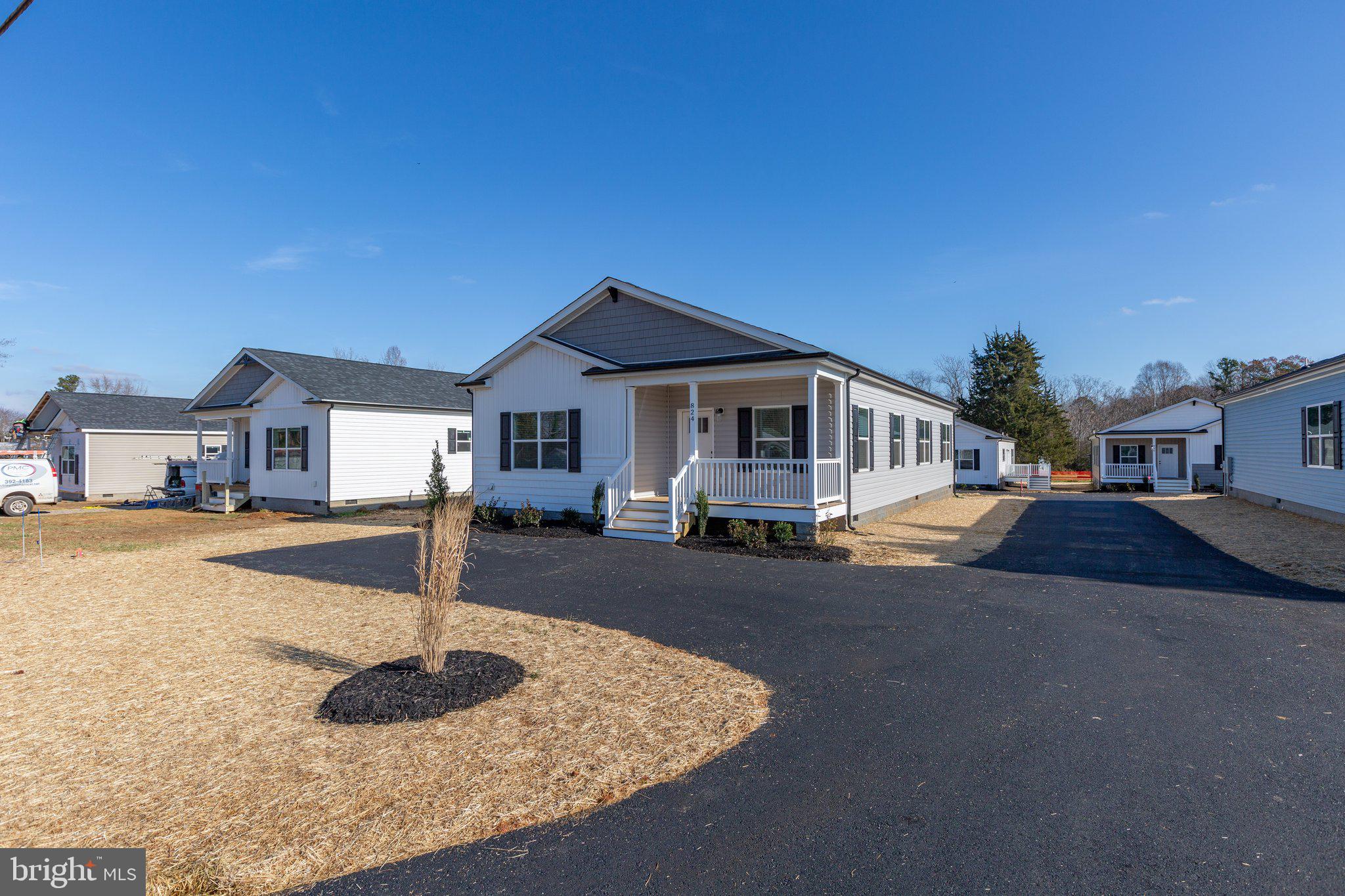 COMPLETE & MOVE-IN READY! Brand-new 3BR/2BA home offering over 1,700 sq. ft. of modern living in the heart of town. Features include 9’ ceilings, crown molding, recessed lighting, black fixtures, pendant lighting, oversized ceiling fan, and custom shiplap accents. Kitchen boasts quartz countertops, tile backsplash, stainless steel appliances, and a large island with abundant cabinet space. Dining room includes sliding glass door leading to a 12x14 rear deck with vinyl rails.
Primary suite offers walk-in closet, dual vanities, and custom tile shower. Exterior highlights include 6’x15’ covered front porch with stacked stone, black gutters and pediments, professional landscaping, and paved parking. Connected to public water and sewer.
Great location—15 mins to Lake Anna, 40 mins to Short Pump, and 45 mins to Charlottesville. Local park and baseball field within walking distance. High school with track just 1.7 miles away. Dog park located 2 miles from the home.
Louisa County schools have been a top-rated school district—recognized as one of the 2023 Best School Districts in America. Seller will cover first year of lawn maintenance. Additional lots and floor plans available.