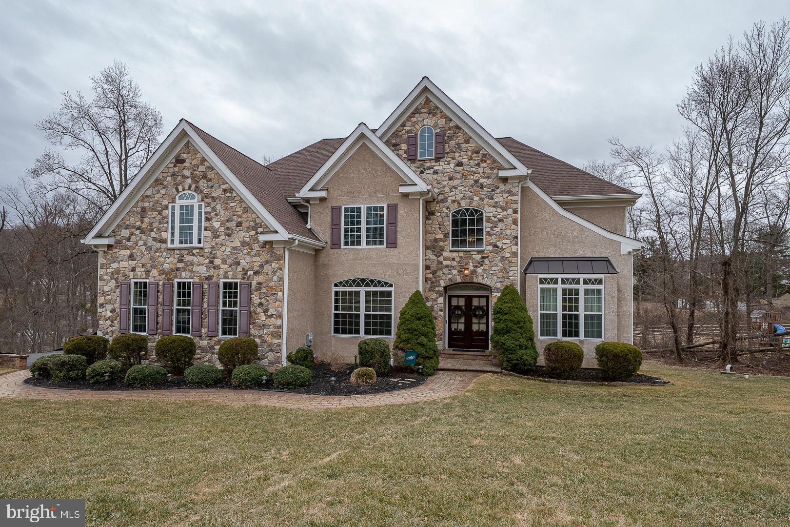 Welcome to 170 Andrien Road, a spectacular home  and property tucked away in the heart of Glen Mills.  Enter the foyer, which lends itself to a flexible floor plan.  The front room is currently functioning as an office, with a full bath and nice size closet. The large living room flows into a beautiful dining room space, with plenty of  entertaining space.   The heart of the home , gourmet kitchen , large dining area and island leads into a 2 story great room with custom bookshelves. Patio doors  lead to a large deck, ample space for outside entertainment.
The second floor boasts a large en-suite , fire place sitting area, his and her closets, soaking tub, radiant heat flooring,  plenty of vanity space. The second and third bedrooms  share  an oversized Jack N Jill bath. The fourth bedroom has a large private bath and all have plenty of closet space.
The lower level has many uses, a beautiful bar  for all your entertainment needs,  A large seating area to watch the big screen , walk out to a patio,  separate bonus room, mechanical room and powder room.  Walk the beautifully landscaped grounds to the over sized  driveway.
Public record is incorrect, the lot size is approximately 1 acre!
Connection to public sewer will be completed prior to closing .