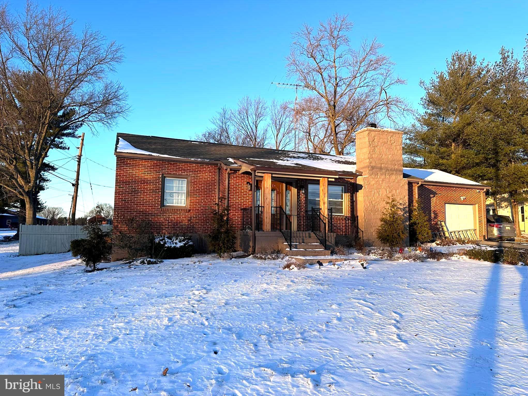 This elegant home offers sweeping views of the neighborhood and distant mountains. The exterior features mature landscaping and a fenced rear yard, along with ample parking provided by the side-loading garage and paved driveway. Upon entry, you're welcomed by a radiant foyer boasting 2-story ceilings, hardwood floors, and an open design. Adjacent to the foyer is a private home office with custom built-ins, perfect for remote work. To the left, the formal living and dining rooms showcase circle-top windows, columns, and crown molding. Continuing, the heart of the home is the expansive open kitchen and family room, featuring hardwood floors, recessed lighting, a fireplace, and abundant natural light from custom windows. The kitchen is outfitted with stainless steel appliances, a large walk-in pantry, and a breakfast table area. French doors lead from the kitchen to the rear patio for outdoor relaxation. The primary owner's suite retreat and three additional sizable bedrooms. A second full bath with dual rooms is conveniently situated on this level. The lower level offers built-in storage and a finished rec room with custom built-ins and high ceilings. The home has been freshly painted throughout, with newer carpeting in most areas. Pets may be considered case-by-case with an additional deposit. The tenant is responsible for all utilities, snow removal, and lawn care.