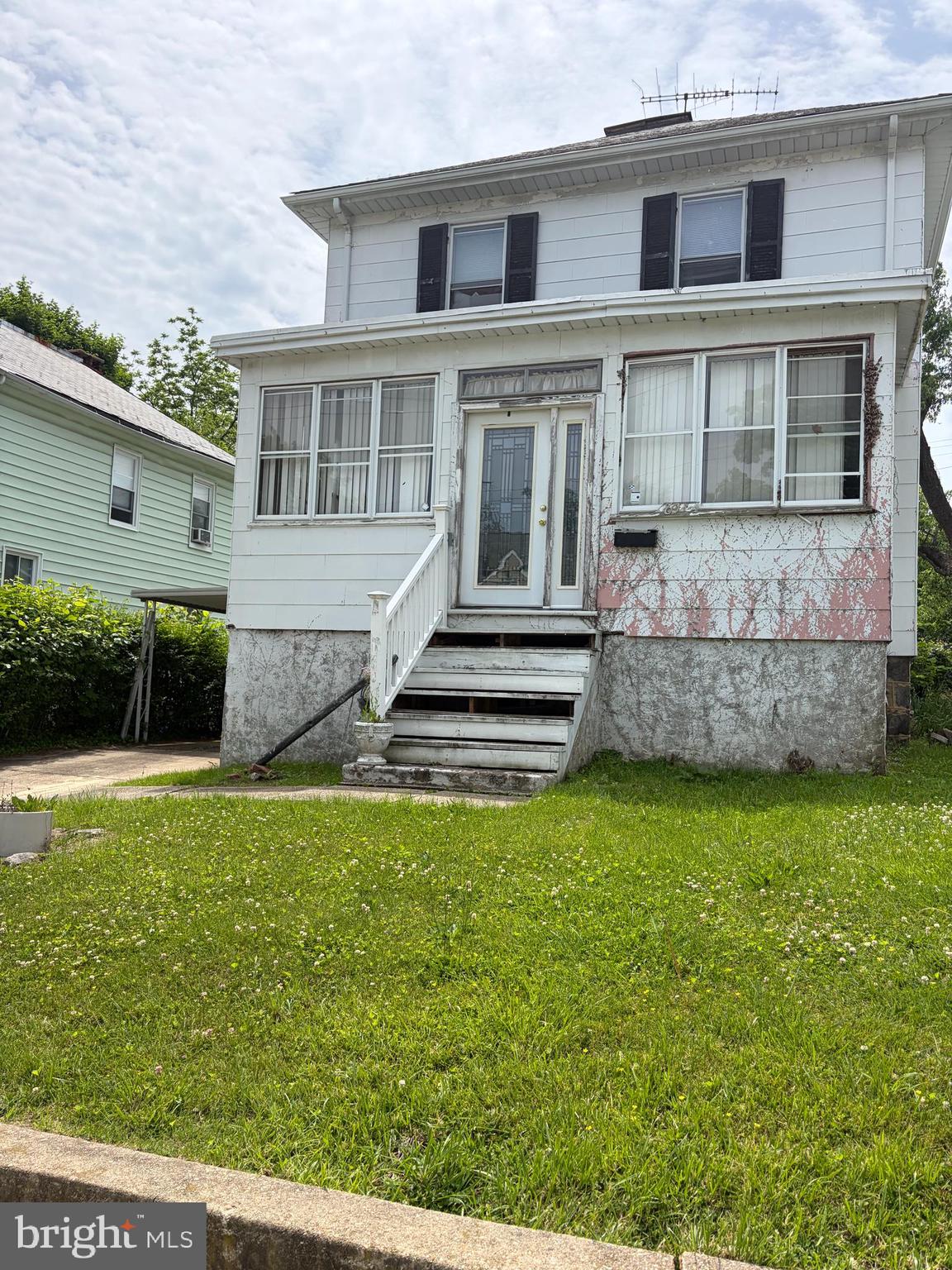 ESTATE SALE - calling all investors to this 4 bedroom1.5 bath detached home in Wilson Park with  PARKING!  The possibilities are endless!   Close to schools,  universities, downtown, Hampden, Northwood,  shopping, major highways.  Bring your vision and your tool kit.  Kitchen has a built-in picnic table and benches, stainless steel appliances.  Enclosed front porch opens to spacious living room.  There is a separate dining room.  The lower level features a laundry room and recreation room with a bar.  There is a half bath in lower level.  The upper level boasts 4 bedrooms and another full bathroom.  There is a patio area in the oversized backyard.  Perfect for summer cookouts, family gatherings!  
An attached carport provides the convenience of parking 2+ vehicles.  Please note there is a possibility of mold in the lower level.  SOLD STRICTLY AS IS -WHERE IS.  Seller cannot make repairs.  Any items/furniture left in the property will have to be removed by the Buyer.