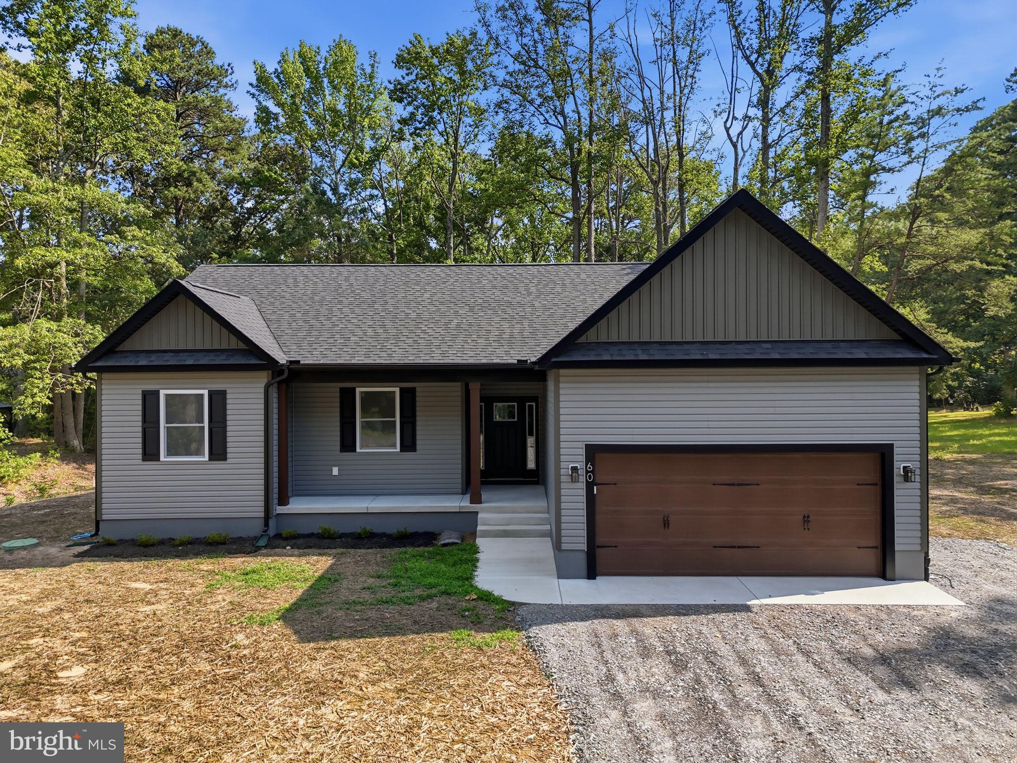 Peaceful setting, screened porch living, and brand-new construction — this one checks every box.

Welcome to this beautifully designed 1,700 sq ft home nestled on a private cul-de-sac in the water-oriented community of Cabin Point. Completed and move-in ready, this thoughtfully designed home combines modern finishes with comfortable everyday living.

Vaulted ceilings in the living room and primary suite create a bright, open feel, while a poured concrete foundation provides lasting quality and peace of mind. The kitchen and bathrooms feature granite countertops, stainless steel appliances, upgraded trim, soft-close cabinetry, and luxury vinyl plank flooring throughout. Elegant tile finishes add a touch of luxury to the bathrooms.

The spacious primary suite serves as a private retreat, complete with separate vanities, a large soaking tub, an oversized tiled shower, and a generous walk-in closet. Enjoy cozy evenings by the gas fireplace or relax on the 14x16 screened porch overlooking the peaceful wooded setting. The property also backs to Betty's Pond, adding to the privacy and tranquil atmosphere.

Residents of Cabin Point enjoy access to four sandy beaches, a boat ramp, swimming pool, tennis courts, and clubhouse. Conveniently located less than two hours from both Washington and Richmond, this home offers the perfect blend of modern comfort, natural beauty, and community amenities. Move right in and start enjoying everything this exceptional property has to offer.