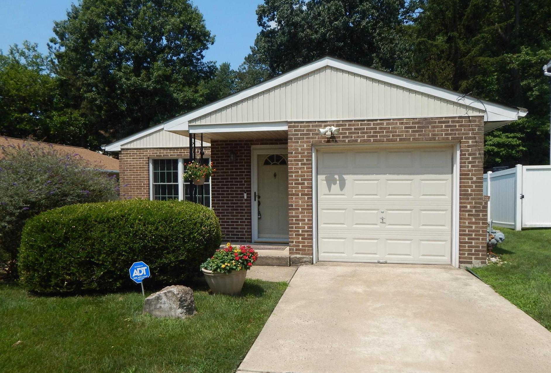 This charming ranch-style home in the desirable Elkins Park neighborhood offers a perfect blend of comfort and functionality. With  over 1,300 square feet of well-designed living space, this residence features three inviting bedrooms and two full bathrooms, ensuring ample room for relaxation and privacy. Step inside to discover a warm and welcoming atmosphere, highlighted by beautiful wood laminate flooring throughout the living room, dining area and hall. The eat-in kitchen has plenty of counter space and storage, making meal prep and cleanup a breeze. The , while the main floor laundry adds to large sunny windows, central air, laundry room with side door, and vaulted ceilings make this home comfortable and practical. The attached garage offers easy access and additional storage, complemented by driveway parking for guests. Set on a manageable 0.12-acre lot, this home is surrounded by a friendly community atmosphere, making it a wonderful place to create lasting memories. With its excellent condition and thoughtful features, this property is ready to welcome you home. Don't miss the opportunity to make this delightful residence your own!