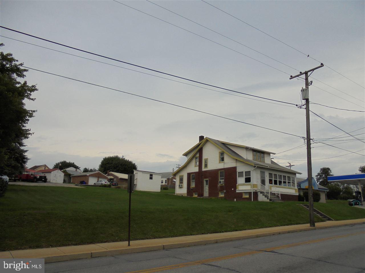 Great opportunity in York New Salem, prime location for your home or possible sub-division to rent one & build new. Large Cape Cod on double lot, 3 BR's, 1 bath on upper flr, large LR & DR, Laundry hook-up in DR, kitchen, bonus room on 1st flr, & large 1/2 bath. Gas stove but no propane tank. Enclosed front porch. Full basement w/laundry hook-up & lots of storage. Needs work. Boro says either residential or commercial, not both, details w/Boro.