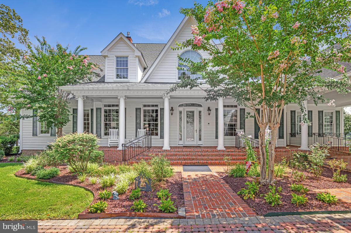 Beautiful Southern Maryland Coastal Retreat. Gracious and sophisticated. Elegant details throughout this incredibly, well-appointed home.  Custom  barrel ceiling and stained glass make a beautiful  statement in the grand entry foyer.  Inviting Family Room with serene water views. Newly renovated gourmet chef's kitchen is a coastal lovers dream. Enjoy sub-zero Wolf and Cove stainless appliances throughout. Custom white Cabinets and a blueberry hued Island grace this light and bright kitchen. Creamy quartz counter-tops and backsplash w/ Kohler ceramic and cast-iron sinks. Custom lighting and hardware.  So very pretty with island seating and prep sink, all with water views. Kitchen and casual dining access to the large waterside screened porch for that morning coffee or evening dinner. Enjoy the walk-in pantry and open sight lines from the kitchen through the casual dining spaces and into the expansive Family Room. Warm Brazilian Cherry hardwood flooring flows through most of this spectacular home.  Stunning water and garden views abound. Formal Dining Room with Cherry Built-Ins and pretty French pocket doors. A newly remodeled cozy mud room w/ fireplace makes a fabulous drop-zone for family and friends.  Enjoy your Office library with cherry Built-Ins.  Main Floor Primary Suite Wing has dual renovated bathrooms complete with heated floors and steam shower. Dual walk-in closets. Relax in the Great Room with cherry built-ins, a gas fireplace and custom windows to optimize all the pretty water-views. Front and Back Deep Covered porches to enjoy Alfresco Dining, Entertaining and Peaceful Tranquility. Take the Elevator or stairs up to the 2nd floor for the additional bedroom suites. Lovely  bonus Room upstairs for additional guests or a tucked away water view retreat. Custom arched doorways and rounded corners throughout. Niches and storage make this home so very special.  Basement has multiple rooms and  of course, MORE storage; a walk-in safe, a severe weather safety room,  exercise and hobby space, a half bath and more.   
4+ Car Garage is attached to the home via covered Breezeway. The entire space above the Garages is available for storage or expansion with upper access from the house via a gallery w/skylights or a wide staircase inside the garage. Pier is Large and has been expanded to include two lifts (20,000lb and 7,500lb) to meet all your boating and kayaking needs. Over 300' of shoreline on scenic Combs Creek (6-8' deep at  end of pier) and 5 minute boat ride to Breton Bay and the Potomac.  This home blends one-of-a-kind customized luxury with Southern Living Charm.  Located 5 minutes from the heart of Leonardtown you'll have all the privacy you could desire in your waterfront home yet still be close to area shopping and events. So much to love and see in this stunning custom home. Over 5900 finished sf above grade alone! Another 1720 sf is partially finished in the basement. The unfinished space above the garages is sub-floored and ready for your next expansion project. You will have room for everything and more. The perfect Retreat. 30 Minutes to NAS Patuxent River and 90 minutes to DC and VA. Appointment ONLY listing with prior notice required.