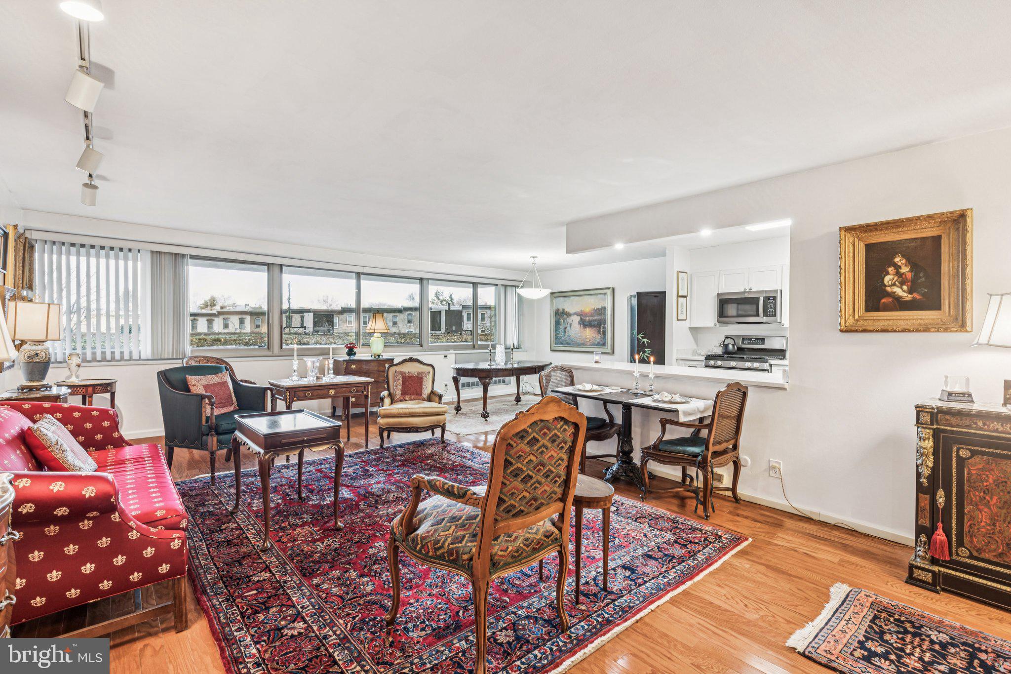 Renovated spacious two bedroom with a split floorplan at The Philadelphian. This turnkey home has been lovingly cared for by its owners who are so sad to be leaving due to a relocation. The residence features excellent entertaining space, generously sized rooms, beautiful natural light from oversized windows, a fully updated kitchen, and hardwood floors throughout. Enter through the welcoming foyer into the spacious, open great room with a wall of windows and ample room for various living and dining layouts. Open to the great room is the fully renovated kitchen with white shaker cabinetry including display cabinets, Corian countertops, stainless steel sink with garbage disposal, breakfast bar, vinyl floor, and stainless steel appliances including a refrigerator with water dispenser. There is also an LG combo washer/dryer. The incredibly spacious primary bedroom boasts more oversized windows, a large dressing area with two walls of closets, and an ensuite bathroom with tub shower and custom tilework throughout. The second bedroom is generously sized and enjoy a deep wall closet and use of a full hall bathroom with stall shower, updated vanity, and custom tilework throughout. There is amazing closet space throughout the home including a large walk-in closet with wood built-ins. The home is conveniently located on the amenities floor, allowing for easy access to the pools and fitness center.  The Philadelphian has often been called a “city within a city” due to the many services and amenities that its residents enjoy. These include a restaurant, grocery store, multiple medical offices, and a beauty parlor. Residents of The Philadelphian rarely have to travel far to accomplish their daily routine, but when the need to leave arises, the building offers a shuttle bus that runs all day long dropping off and picking up residents throughout Center City. Residents also enjoy a 24-hour doorman, indoor and outdoor pools, and a fitness center. On-site garage parking is available for rent (subject to availability).