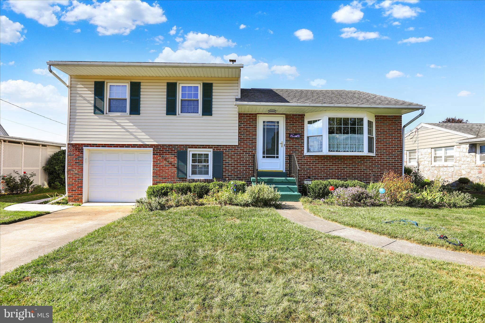 Welcome Home! This beautifully maintained 3-bedroom brick split-level is nestled in the desirable Fleetwood Area School District and ready for its next owner. Recent updates include a brand-new roof and new central air conditioning, giving you peace of mind for years to come. Step inside to find a bright and functional layout. The lower level features a comfortable family room, convenient laundry area, half bath, and a sunny enclosed sunroom that overlooks the spacious rear yard. The main living level boasts a large living room with a charming bay window that floods the space with natural light, a cozy dining area, and a newer kitchen complete with a breakfast island and all appliances included. Upstairs you’ll discover three generously sized bedrooms and a full tiled bathroom. The finished lower level offers excellent additional living space—ideal for a recreation room, home theater, play area, or entertaining—plus a separate storage room. Outside, enjoy a level,  backyard with a storage shed, perfect for gardening, outdoor fun, or relaxing gatherings. Additional highlights include a driveway with off-street parking and an attached one-car garage. This move-in-ready home is perfectly located near schools,  dining, and major commuting routes—making it an outstanding choice for first-time homebuyers or anyone seeking comfort and convenience. Don’t miss this wonderful opportunity! Schedule your private showing today and make this charming brick split-level yours.