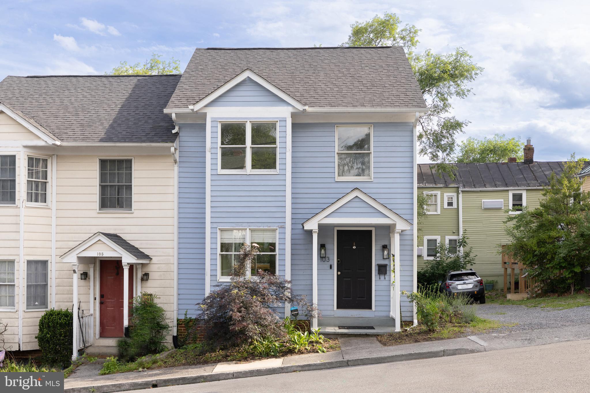 Welcome home to 103 E Germain St, a rare end-of-row townhouse combining the historic elegance of downtown Winchester with the modern ease of late-80s construction. Whether you are a first-time buyer looking for a move-in ready home or a savvy investor looking for a high-demand rental with excellent yield potential, this property ticks every single box. Flooded with natural light, the main level features a desirable open floor plan that effortlessly flows from the inviting living room into a bright, combination kitchen and dining area. Beautiful hardwood floors anchor the main living level, complemented by a convenient half-bath. Step through the rear door to your Trex sun deck complete with cocktail rail—the perfect spot for morning coffee or casual weekend entertaining. Upstairs, you will find two spacious, newly carpeted bedrooms with ample closet space and a full primary bathroom. Need extra storage? The home includes a massive unfinished attic and crawlspace basement to keep your living spaces completely clutter-free. Complete with rare, coveted off-street parking for two vehicles and a small, easy-to-maintain yard, this property offers a premium, low-overhead lifestyle. Enjoy being just blocks away from local dining, shopping, and historical landmarks. Schedule your private tour today!