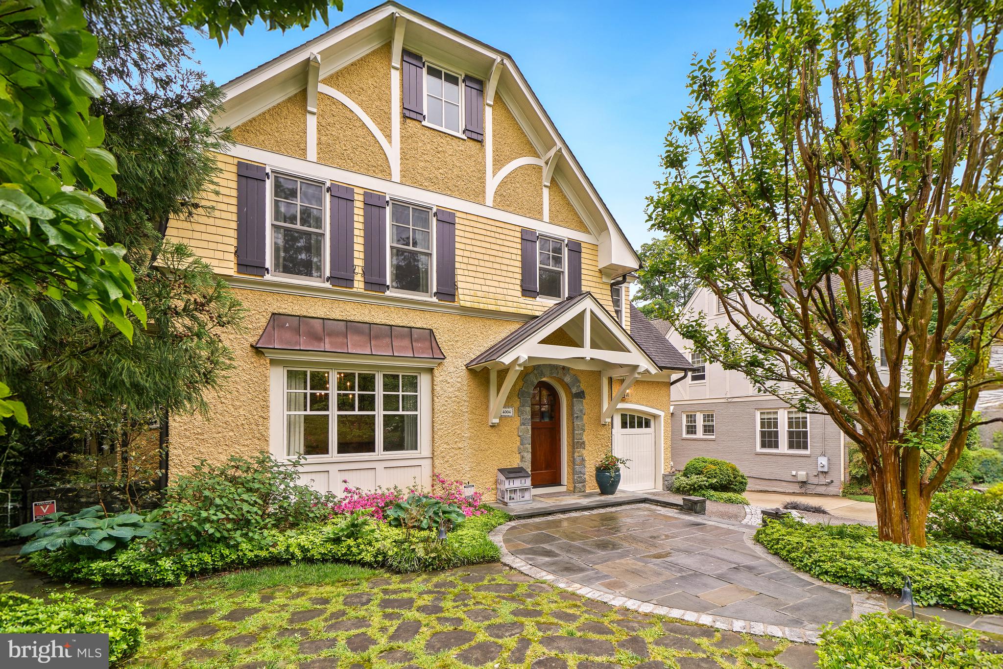 Some homes simply have it — that rare combination of historic character and modern craftsmanship that stops you mid-scroll and makes you need to see it in person. 4004 Underwood is that home.
From the moment you arrive, the pebble dash stucco façade — framed by mature, lushly layered landscaping of flowering trees, roses, peonies, and azaleas — signals that something special awaits. Follow the curved walkway to a custom-designed solid wood entry door, and step inside.
Rift-and-quartered character grade white oak floors carry you through all three above-grade levels, and the details that greet you at every turn are the kind buyers spend years searching for: rich moldings, bespoke built-ins, a coffered ceiling and antique fireplace mantel in the family room, and a soaring cathedral ceiling that transforms the primary bedroom into a true retreat. On the lower level, radiant heated polished concrete adds a sleek, modern counterpoint — while the mudroom’s handmade hexagonal French terra cotta tile adds one more layer of unexpected delight.
The kitchen is a craftsman’s statement. Solid ash cabinetry by Wm Ohs of Colorado — one of the country’s most respected custom cabinet makers — pairs with honed Absolute Black granite countertops for a look that is simultaneously timeless and refined. A custom pine built-in hutch anchors the breakfast area with warmth and practicality.
Then there is the screened porch — and once you see it, you will understand why it may be the home’s most beloved space. At 14 by 18 feet, with mahogany flooring and a bead board cathedral ceiling, it is the kind of room that turns summer evenings into something worth savoring.
Practical considerations are equally impressive. Finding two garage spaces in the Town of Chevy Chase is itself a rarity. The attached garage includes a 220-volt line for EV charging, while the detached original garage has been thoughtfully reimagined as a garden shed, storage space, and entertaining room complete with custom sliding barn doors — flexible square footage that grows with your needs.
And underpinning it all: a dual-zone geothermal HVAC system that delivers exceptional year-round comfort while also assisting with water heating — an investment in both sustainability and long-term savings.
4004 Underwood is not a house that was renovated to look like something special. It is something special — a superior quality, recently constructed home built on a century of character, elevated by craftspeople who cared about every last detail. Some homes you tour. This one you remember.
OPEN SUNDAY 2-4