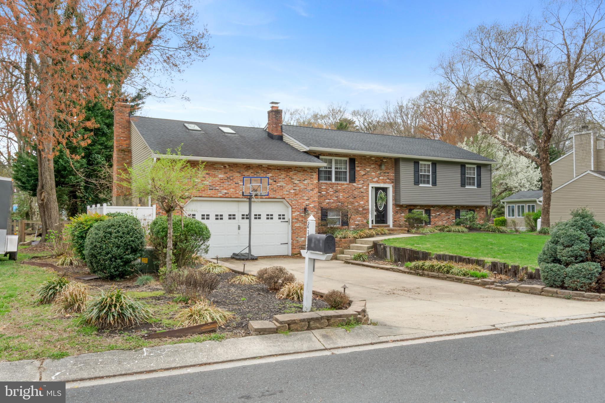 Welcome to 8339 Capel Dr, Pasadena, MD 21122 — a beautifully updated 4-bedroom, 3-bathroom split-foyer home offering over 3,100 square feet of inviting, flexible living space.

Step inside to a light-filled open floor plan featuring hardwood floors and a spacious great room perfect for entertaining. The kitchen is a chef’s dream with stainless steel appliances, premium countertops, a breakfast bar, easy-close drawers and cabinets, and a large island for added prep space. Enjoy the warmth of two brick fireplaces creating cozy zones for relaxation.

The sunroom opens onto a large deck, seamlessly blending indoor and outdoor living. Downstairs, a walkout basement with waterproof flooring (installed in 2022) leads to a paver patio and a hot tub (only 3 years old) — all within a large, enclosed backyard ideal for year-round enjoyment. Additional highlights include a 2.5-car garage, off-street parking, and recent major upgrades: new roof (2019), new HVAC (2023), and a new water heater (2025).

Located near parks, golf courses, and family-friendly attractions, with easy access to MD-100, MD-2, and I-97 for a smooth commute.

This move-in ready home combines comfort, function, and style — schedule your tour today!