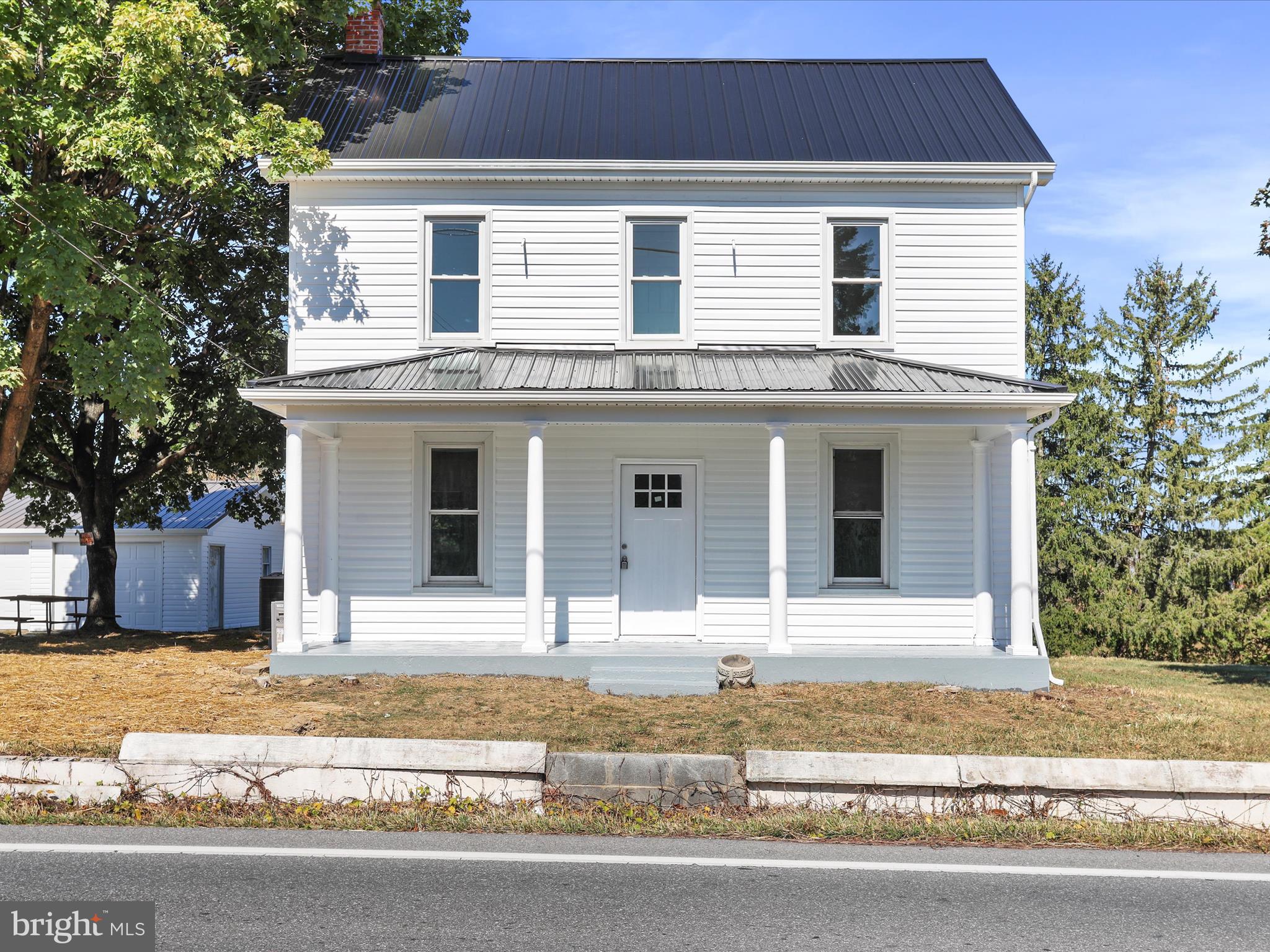 *Buyer home sale fell through* Newly renovated colonial on an unrestricted lot in falling waters!  New windows, metal roof, siding, hvac, lights, paint, floors, everything!  Detached 2 car garage.  Great home in a great location, bring the chickens!
