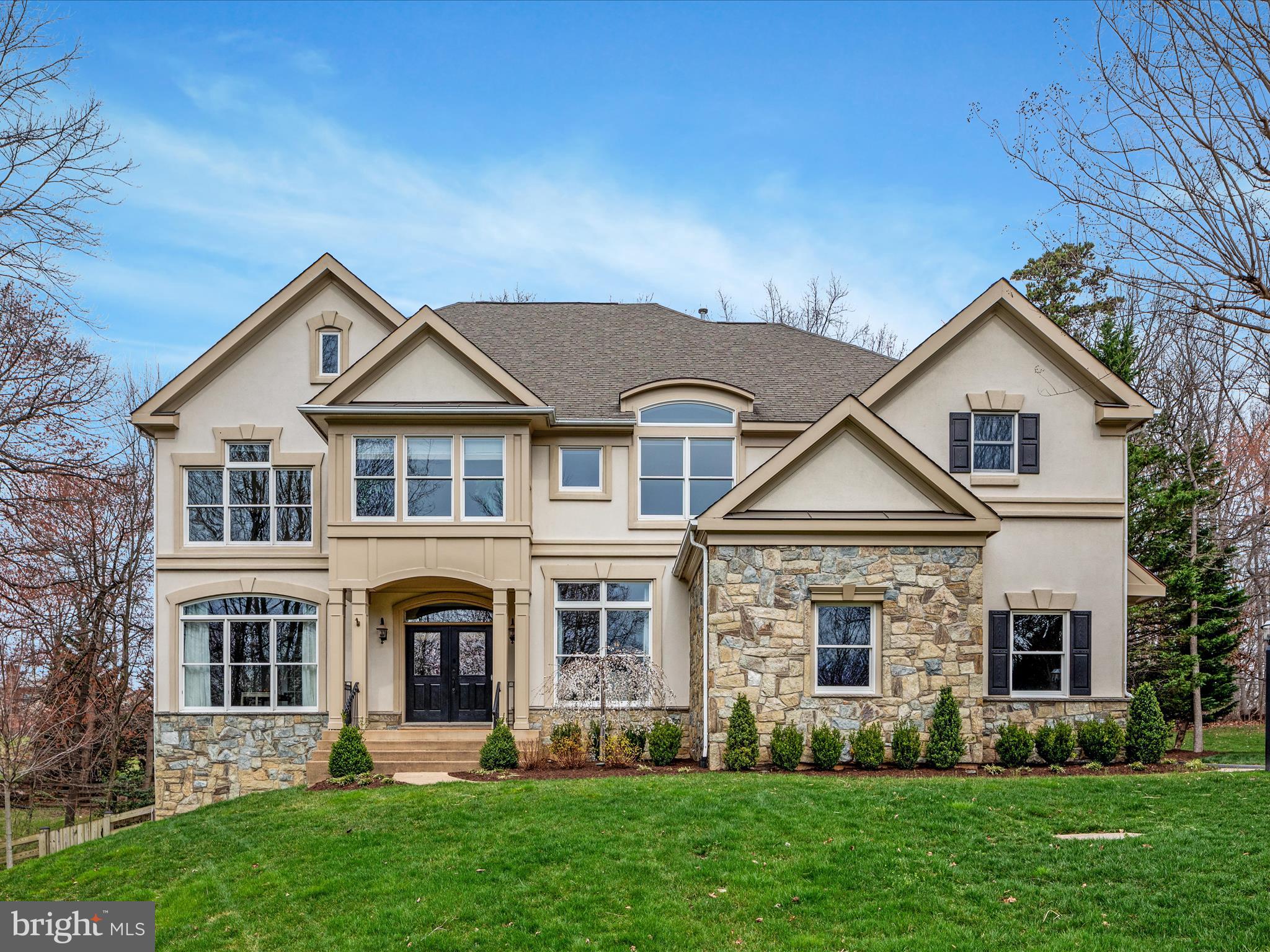 One of a kind, custom-built single-family home, epitomizes luxury living without sacrificing character. Transitional styling with beautiful stone and stucco facade, and prominently perched on a generous .65-acre lot, this residence boasts impeccable craftsmanship and distinctive features that set it apart from the rest. Peaceful and private, yet ideally located within minutes of shopping, dining and Oakton/Fairfax/Reston amenities.
A long driveway flanked by a lush lawn and mature wooded lot greets you with open arms. 
Step inside and be impressed by an inviting atmosphere, highlighted by fine hardwood floors and 10-foot ceilings. A creative  floor plan boasts custom molding running throughout with great attention to quality and detail. Grand entryway features dramatic two-sided fireplace, setting the tone for warmth and sophistication, while natural light pours in through the architectural transom windows.
Newer HVAC systems and water heater will provide the new owners many years of comfort. Entertain with ease in the spacious living areas, including a formal dining room overlooking the fairway-like front yard.  The gourmet kitchen is chef quality, complete with high-end appliances, granite countertops and center island. Enjoy casual meals in the eat in breakfast area and relax in the cozy family room adjacent to the kitchen.  The custom screened-in porch is a wonderful addition for al fresco dining and enjoying wooded views. Main level also features a convenient home office for remote work or study. Upstairs, you’ll find four generously sized bedrooms, including an expansive primary suite with tray ceiling,sitting area, ensuite bath and dual walk-in closets. A bonus fifth room with cork flooring offers versatility as a gym, playroom, or additional living space. 
The finished lower level of this beautiful home provides plenty of space for the entire family.  A fifth bedroom with full bathroom, is ideal for guests or in-law suite. The large recreation area offers flexibility to make your own and rear yard access via walk out. Huge amount of storage space features custom built-in shelving and room for future expansion.  
All of this with an A+ location, a highly desirable neighborhood and zoned to top-rated Oakton school pyramid. Major routes, Fair Oaks Hospital, International CC nearby. Walk to Navy Elementary.  Don't miss the perfect place to call home!