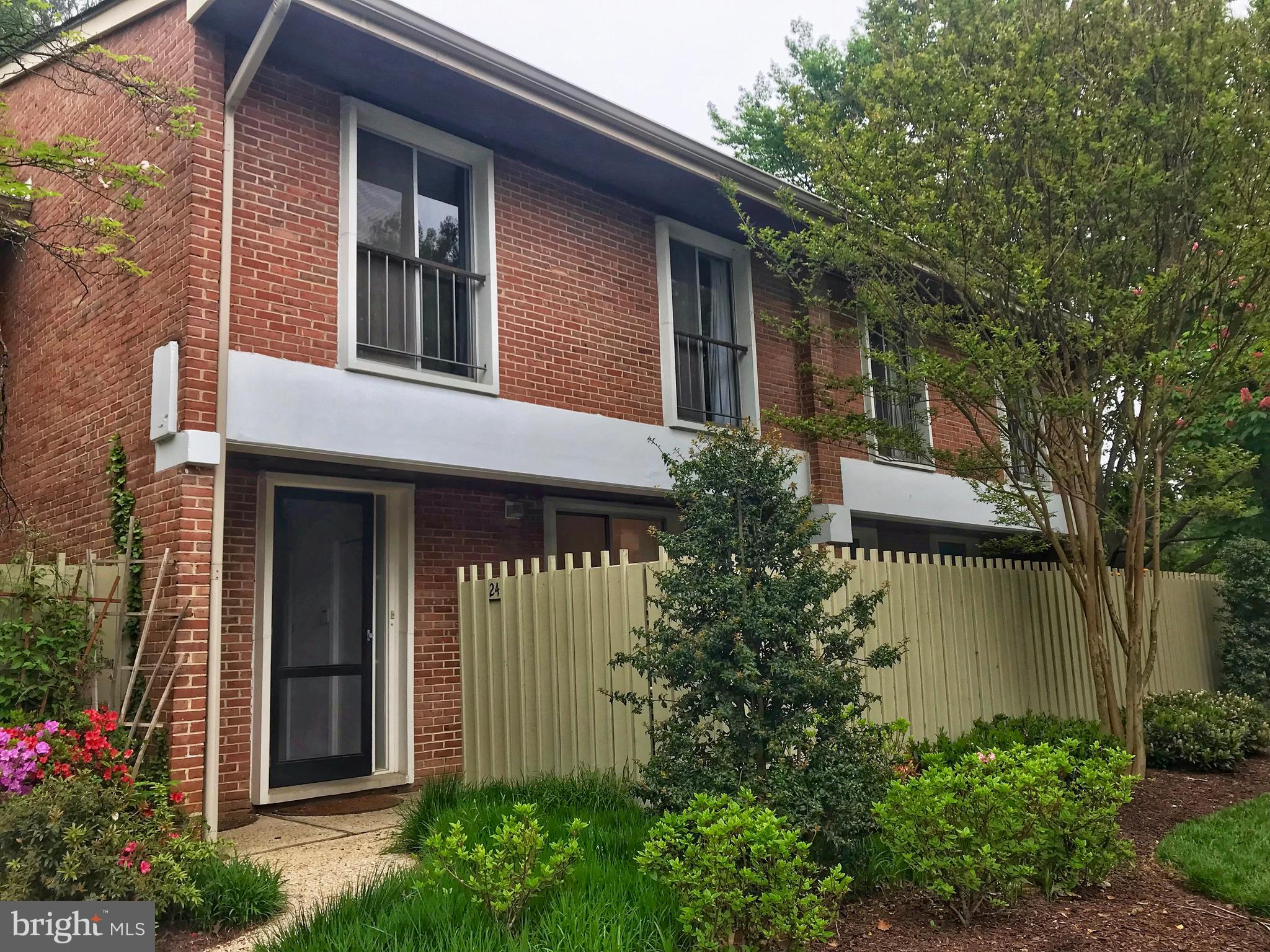 Terrific location in sought after, gated Cross Keys. Hardwood floors, fireplace, 3 BR's, 2.5 baths, eat-in kitchen. Private front & rear courtyards. Community pools and tennis.