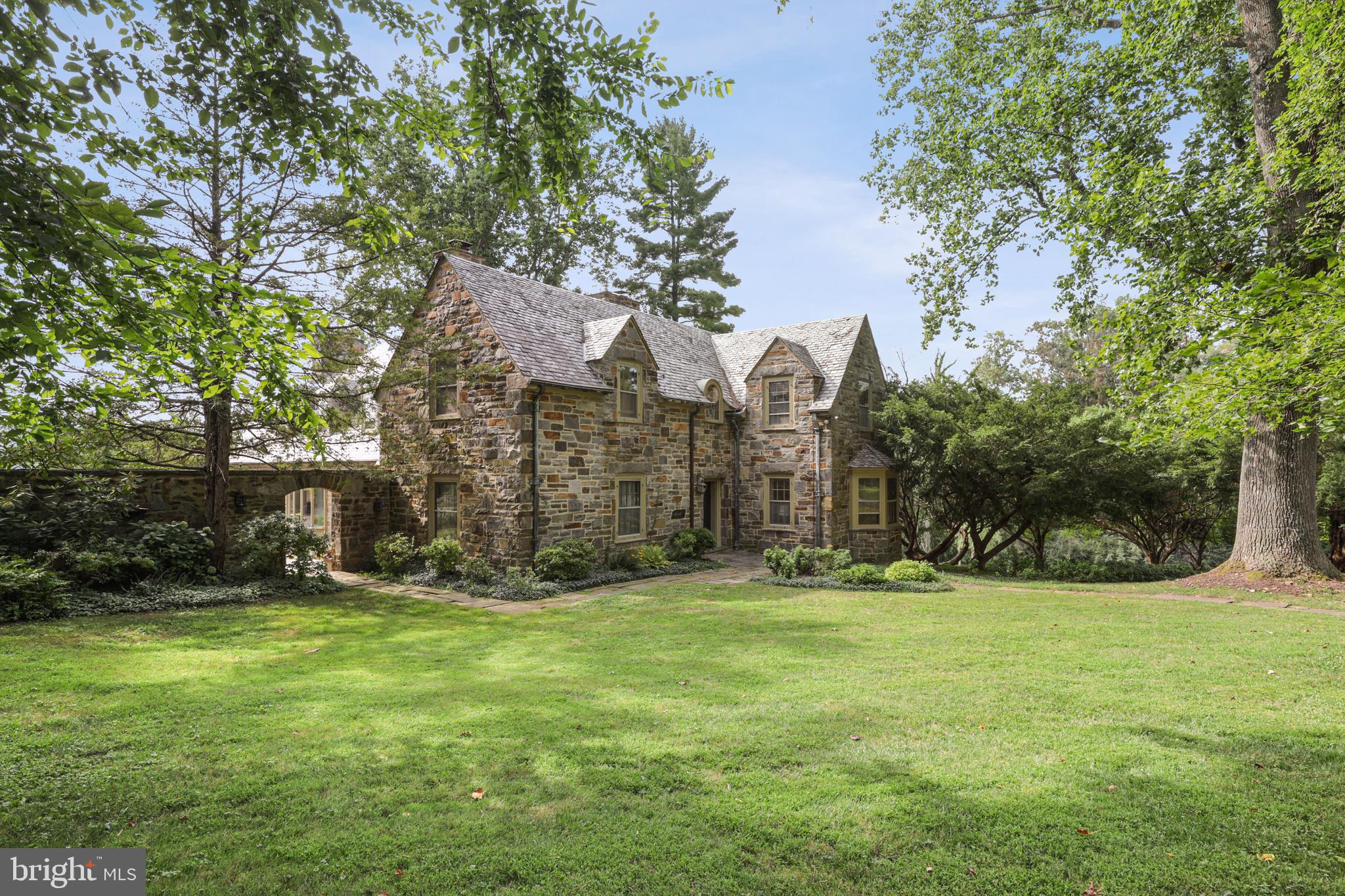 Be enchanted! Immerse yourself in turn-of-the-century ambiance that graces this statuesque all-stone manse and embrace the countryside lifestyle it bestows upon its residents while enjoying every contemporary convenience. A Carriage House in its former life, this beauty boasts much original millwork, 3 wood burning fireplaces, a coy Den, formal Dining Room, dramatic Solarium and an IMPRESSIVE 30' x 21' Great Room! The Upper Level offers an entire West Wing as the Owners' Suite with marble luxe Bath, Dressing Area, fireplace in bedroom and  TWO balconies (West and North). The Upper Level East Wing is conveniently laid out with the additional 3 bedrooms, TWO more Full Baths and Laundry.  Bonus Room in the Lower Level awaits your specific needs (Exercise Room? Craft/Workshop?)  You'll want to hold on to every sunset and greet every sunrise from the numerous stone verandas, porches and balconies - overlooking the rolling hillsides that meet the Loch Raven Reservoir lands.  Absolutely dreamy!