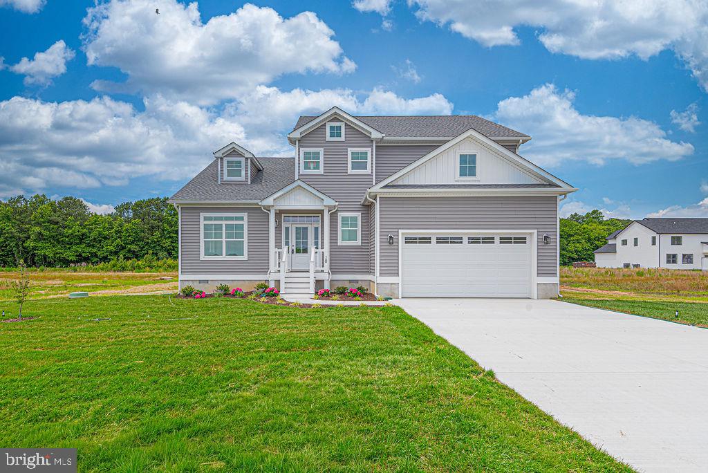 Brand new construction now completed ready for the summer season! This impressive home offers over 3,400 square feet of living space with 5 bedrooms, 3.5 baths, and a bonus room, providing exceptional flexibility for today’s lifestyle. Located on a quiet cul-de-sac in Triple Crown Estates, a community known for its larger lot sizes, this property features a generous 125’ x 100’ homesite.

The home offers two primary suites — one on each level. The first-floor primary suite features a beautifully tiled shower, while all full bathrooms are equipped with double-bowl vanities. The stunning kitchen showcases quartz countertops and stainless steel appliances and flows seamlessly into the dining area, which opens to a screened porch and deck, perfect for indoor-outdoor living. The family room is warm and inviting with a linear electric fireplace and a beam-accented vaulted ceiling.

Additional highlights include 9’ ceilings on the first floor, LVP flooring throughout the first floor and staircase, a dedicated laundry room, and an 80-gallon hot water heater. The oversized two-car garage features 12’ ceilings, offering excellent potential for additional storage space. The bonus room is separately conditioned with its own split HVAC system, making it ideal for a media room, home office, playroom, or guest retreat.

Enjoy all that Ocean Pines has to offer, including multiple pools, golf course, marina, yacht club, beach club in Ocean City, parks, walking trails, and year-round community amenities. Builder Registration #9569.