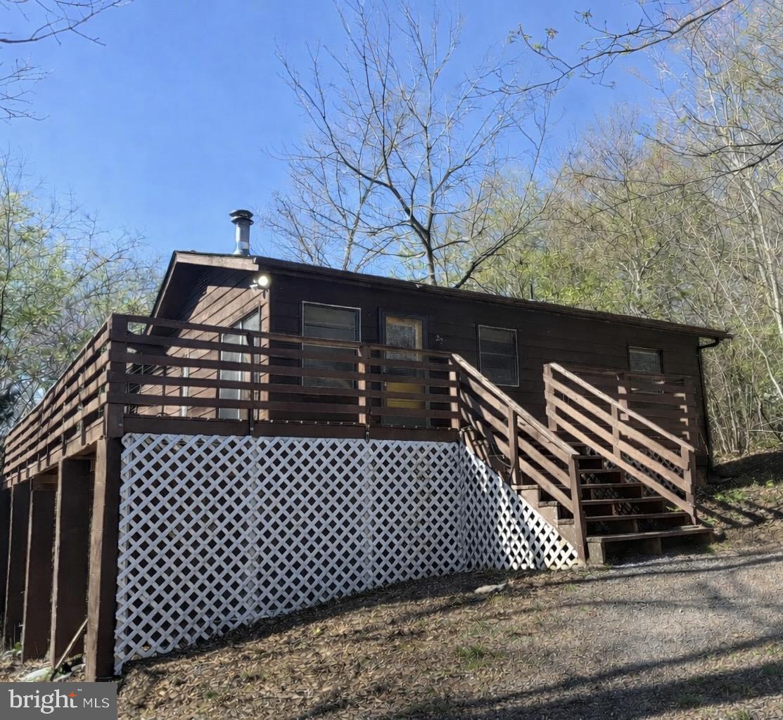 Cabin tucked away in the woods just 3 miles from Bryce Resort with a ton of potential. This property offers a great opportunity for investors, short-term rental buyers, or anyone looking to add value.

Features include a private, wooded setting and a wraparound deck—perfect for enjoying the peaceful surroundings while still being close to skiing, golf, hiking, wineries, and other Shenandoah Valley attractions.

Short-term rentals (Airbnb) are permitted—buyer to verify. Property is being sold as-is and priced accordingly. With a little TLC, this could make a great weekend getaway, investment property, or full-time home.