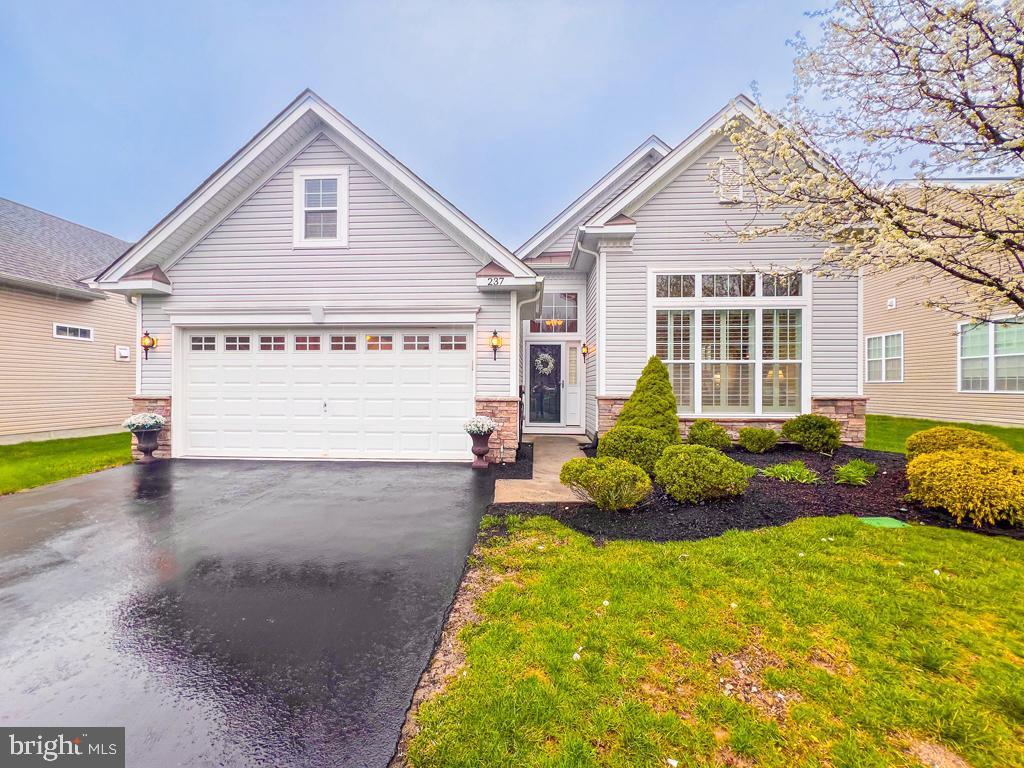A Picture-Perfect Retreat Designed for Easy Living. Welcome to your next chapter in this beautifully maintained, move-in-ready home—perfectly suited for the active adult lifestyle. From the moment you arrive, the charming curb appeal and fresh, well-kept exterior set the stage for the warm, inviting interior that awaits. Step into a welcoming foyer that opens to a formal living and dining room combination, beautifully lit by a wall of front-facing windows. The natural light and open layout create a bright, cheerful atmosphere that feels like home from the start. At the heart of the home, the white kitchen and spacious great room offer the ideal setting for relaxing or entertaining. With an abundance of white custom cabinetry, granite countertops, stainless steel appliances, and a coordinating backsplash, this kitchen is as functional as it is stylish. A large breakfast bar seats five comfortably, and the pantry provides convenient storage. The family room and breakfast area flow seamlessly together, perfect for casual gatherings or peaceful mornings with a cup of coffee. The main bedroom suite is a serene retreat, with soft colors, custom moldings, chair rail accents, and a tray ceiling adding a touch of elegance. The en suite bath features double sinks, a stall shower,. There is also a walk-in closet with room for all your full wardrobe. The home also offers a second bedroom  convenient to a full hall bath—ideal for visiting family or friends—as well as a well-appointed laundry/mudroom. The seller has thoughtfully added a staircase to a walk-up loft, providing extra space for a den, guest room, or additional storage.bA spacious 2-car garage completes the home, while the community offers a wealth of amenities to enrich your retirement lifestyle. Enjoy indoor and outdoor pools, pickleball, canasta, mah-jong, and a full calendar of social programs and events that make it easy to connect with neighbors and stay active. Snow is shoveled to your front door and all landscaping is taken care of. Low-maintenance, light-filled, and full of thoughtful upgrades—this spectacular home is offered at an exceptional value. Come see it for yourself and imagine the possibilities.