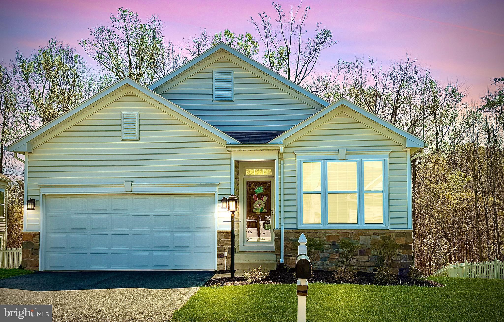 Popular Leeland Station 55+ section  within the Leeland Station Subdivision.  This Lovely one level home with basement boasts open concept living with hard wood floors through out. HOA maintains the yard, including mulching, lawn care and snow removal . This home has been meticulously taken care of by the current owners. New Roof in November 2023, the Primary Bedroom suite is separated from  the other rooms with plenty of space with adjoining full bathroom and walk in new custom closet  by Closets by Design.  
Custom Maple Cabinets feature Double wall ovens  and for the one who loves cooking, a gas cooktop. Nice large kitchen island is perfect  for hosting events and just hanging out to have coffee!  Guest bedroom on main floor with a full bath, double french doors present a beautiful office or possible library or even a gym!  
Wait until you see the spacious basement with a workshop, gym or even room for both!  So much Storage Space!!  The secondary living  room space provides so many possibilities. Plenty of options with all the space you have!  Basement features a walk out onto a stoned patio to relax.  
***Saving one of the best parts for last is the amazing seasonal room on the first floor off of the Living area. This room boasts vaulted wood ceilings, a stone floor,  a floor to ceiling gas fireplace with mantle,  and right  out the door is Trex decking for grilling and relaxing in the peaceful sun.  Back deck overlooks the trees which hosts a walking path beyond.  Stairs accessible to lower level patio or backyard!  Beautiful Home!!  Less than a mile distance to the VRE! Close to downtown Historic Fredericksburg.