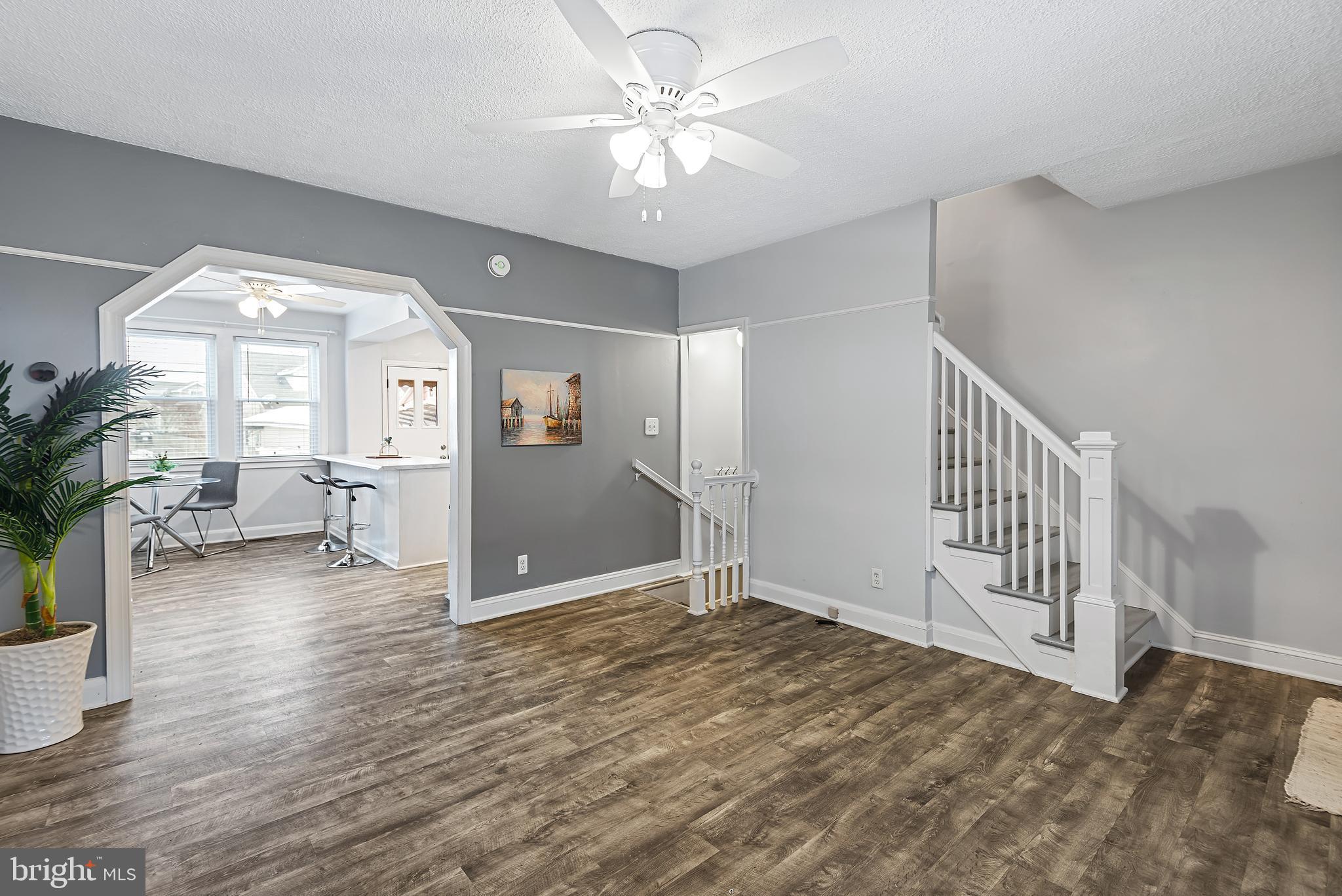 Welcome Home to 158 W Meadow Road in the ideally located community of Brooklyn, just inside Anne Arundel County! When you move into this bright sunny home, you will find yourself in a fully renovated yet affordable 3 Bedroom brick townhome, featuring a new (in 2020) roof, HVAC, double pane vinyl clad windows, flooring, painting, electrical (incl. Nest Smart Thermostat), kitchen, bathroom (fixtures, etc.) and washer / dryer - and a new back yard privacy fence (in 2022)! This charmer features abundant sunlight and a comfortably laid out main level floorplan - all with gleaming hardwood-like floors - flowing smoothly around the spacious living room, dining room, and open design kitchen, featuring a generous center island with eating counter, and stainless steel appliances including a gas cooktop & oven.  A back deck off the kitchen / dining room leads to a privacy fenced back yard with lawn and patio, ready for your next BBQ, crab feast or relaxing with family & friends.  The back gate opens to your parking pad. Part of the home’s lower level was finished (in 2020) to create a spacious family / TV / game room.  This level has a laundry / utility room with washer & dryer, extra storage (with space to install another bathroom if desired) and walks-up to the back yard.  The top floor features a primary and 2  secondary carpeted bedrooms, and a full bathroom. Living in Brooklyn, you’re convenient to everything, from nearby major commuter routes I-95, I-97, I-695, I-895, MD-100 & MD-295 (BW Parkway) to Baltimore, Washington D.C. and Annapolis, and to plenty of family activities, local restaurants, shopping & entertainment. And for some nearby family fun, you’re just a block from Belle Grove Park , with tennis courts and a tot lot, and in close proximity to West Covington Park with beautiful water views, trails and greenspace. So don’t miss out on this opportunity to enjoy an affordable fully remodeled home in a well located friendly community. Welcome Home to 158 W Meadow Road in Brooklyn, Anne Arundel County!