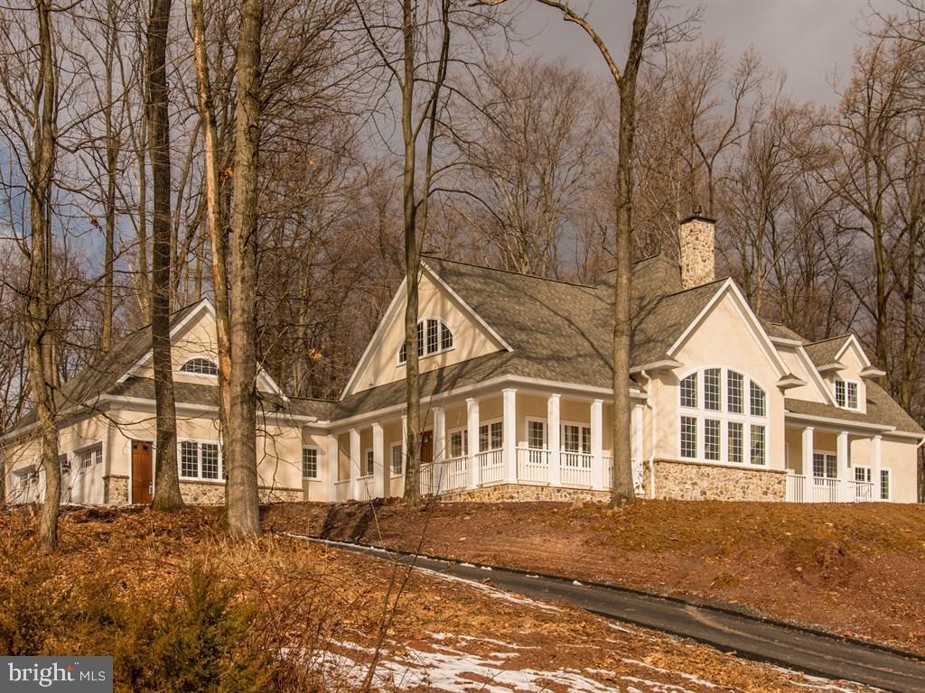 Newly completed, exclusive custom designed home in a majestic setting. Breathtaking great room with vaulted ceiling, wall of windows and floor to ceiling fireplace. The hearth room takes advantage of the beautiful wooded lot to the rear. First floor master suite with elegant bath and separate dressing area. Open kitchen with dual islands, huge finished lower level with kitchenette/bar and fireplace. 24 additional lots available.